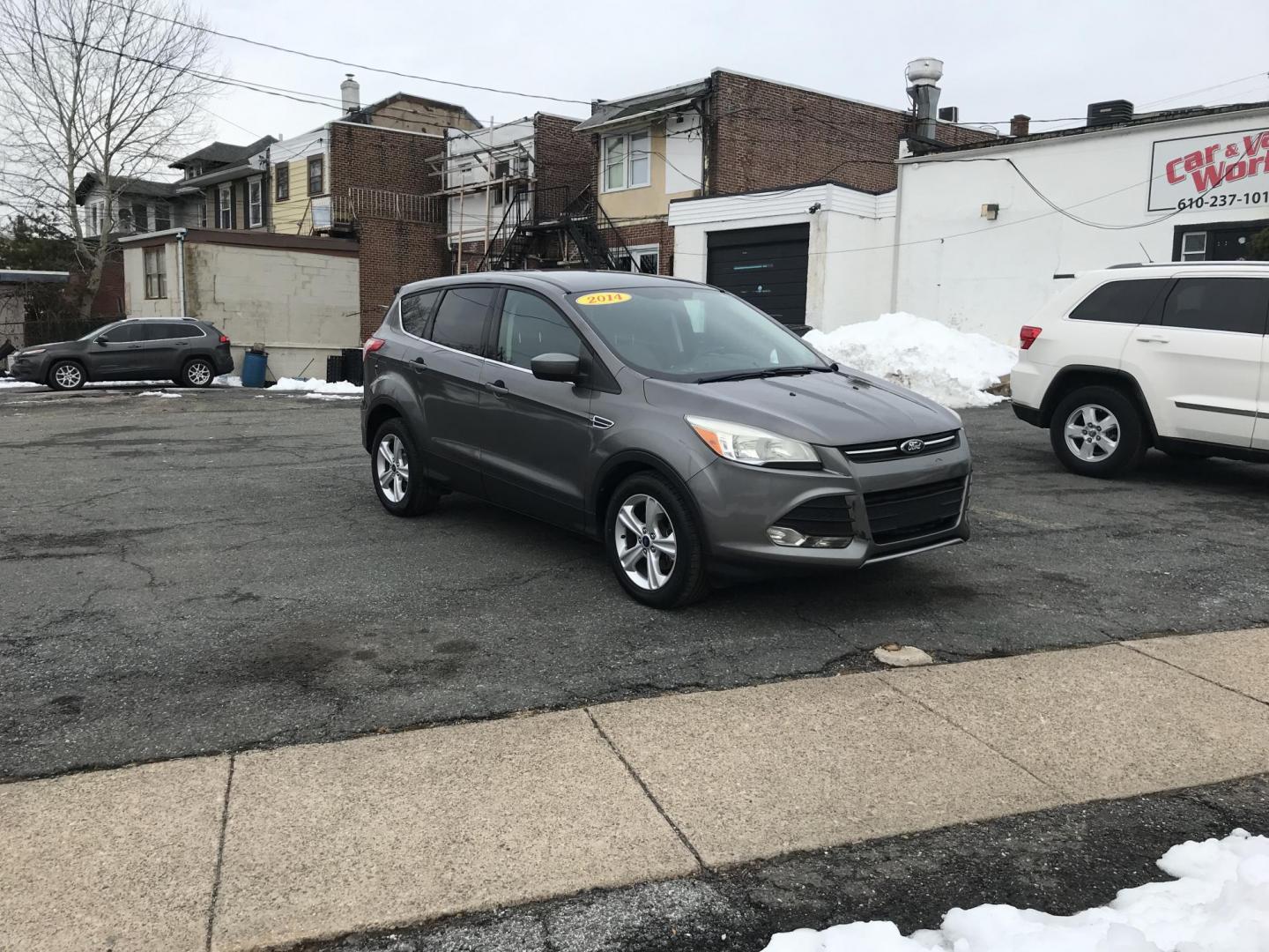 2014 Gray Ford Escape SE FWD (1FMCU0GX7EU) with an 1.6L L4 DOHC 16V engine, 6-Speed Automatic transmission, located at 577 Chester Pike, Prospect Park, PA, 19076, (610) 237-1015, 39.886154, -75.302338 - 2014 Ford Escape: Only 122k miles, great on gas, new PA inspection, SUPER CLEAN, runs LIKE NEW! This vehicle comes inspected and has been given a bumper to bumper safety check. It is very clean, reliable, and well maintained. We offer a unique pay plan that is known for being the easiest and fast - Photo#1