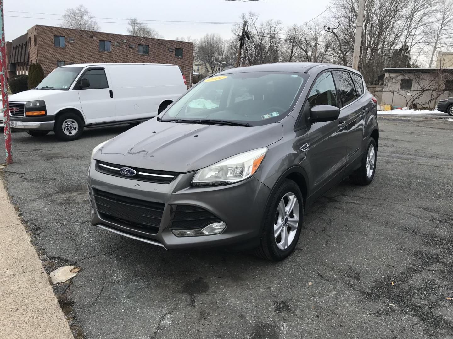 2014 Gray Ford Escape SE FWD (1FMCU0GX7EU) with an 1.6L L4 DOHC 16V engine, 6-Speed Automatic transmission, located at 577 Chester Pike, Prospect Park, PA, 19076, (610) 237-1015, 39.886154, -75.302338 - 2014 Ford Escape: Only 122k miles, great on gas, new PA inspection, SUPER CLEAN, runs LIKE NEW! This vehicle comes inspected and has been given a bumper to bumper safety check. It is very clean, reliable, and well maintained. We offer a unique pay plan that is known for being the easiest and fast - Photo#3