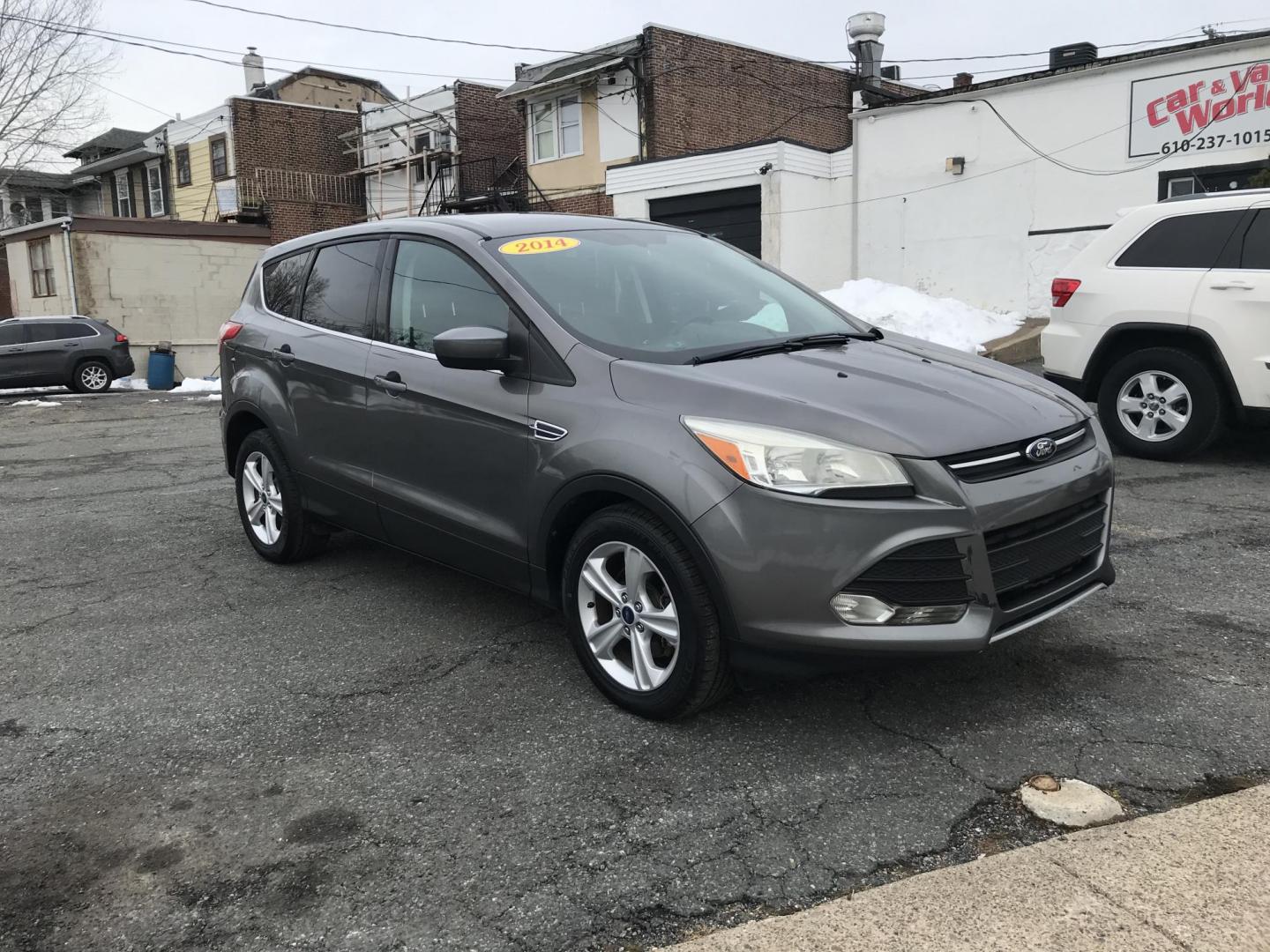 2014 Gray Ford Escape SE FWD (1FMCU0GX7EU) with an 1.6L L4 DOHC 16V engine, 6-Speed Automatic transmission, located at 577 Chester Pike, Prospect Park, PA, 19076, (610) 237-1015, 39.886154, -75.302338 - 2014 Ford Escape: Only 122k miles, great on gas, new PA inspection, SUPER CLEAN, runs LIKE NEW! This vehicle comes inspected and has been given a bumper to bumper safety check. It is very clean, reliable, and well maintained. We offer a unique pay plan that is known for being the easiest and fast - Photo#2