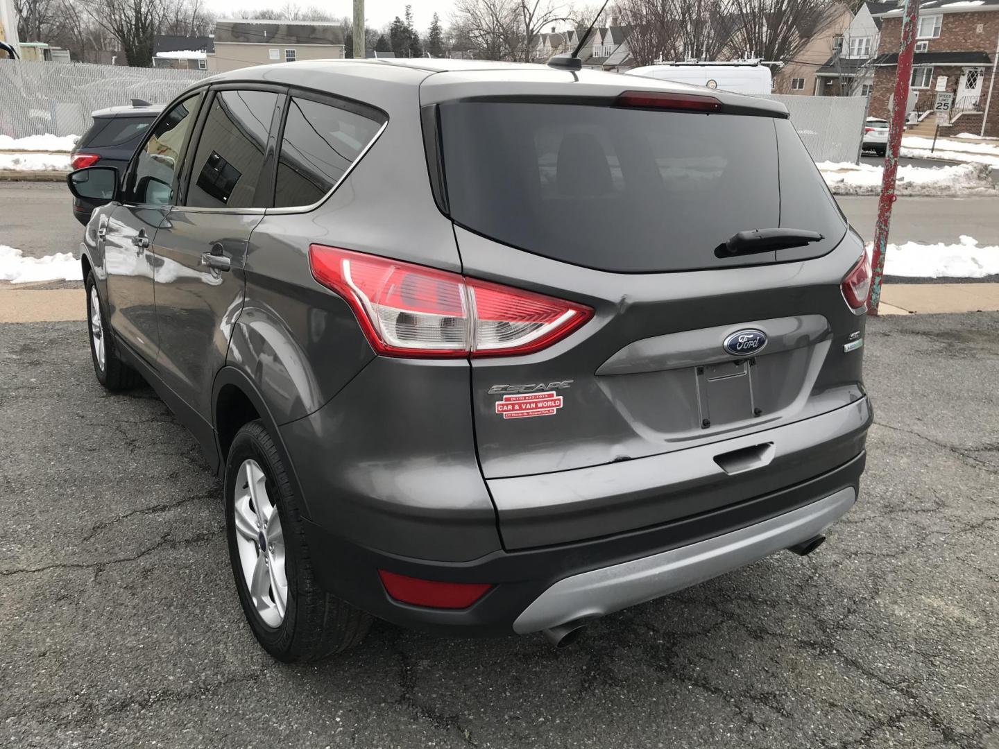 2014 Gray Ford Escape SE FWD (1FMCU0GX7EU) with an 1.6L L4 DOHC 16V engine, 6-Speed Automatic transmission, located at 577 Chester Pike, Prospect Park, PA, 19076, (610) 237-1015, 39.886154, -75.302338 - 2014 Ford Escape: Only 122k miles, great on gas, new PA inspection, SUPER CLEAN, runs LIKE NEW! This vehicle comes inspected and has been given a bumper to bumper safety check. It is very clean, reliable, and well maintained. We offer a unique pay plan that is known for being the easiest and fast - Photo#5
