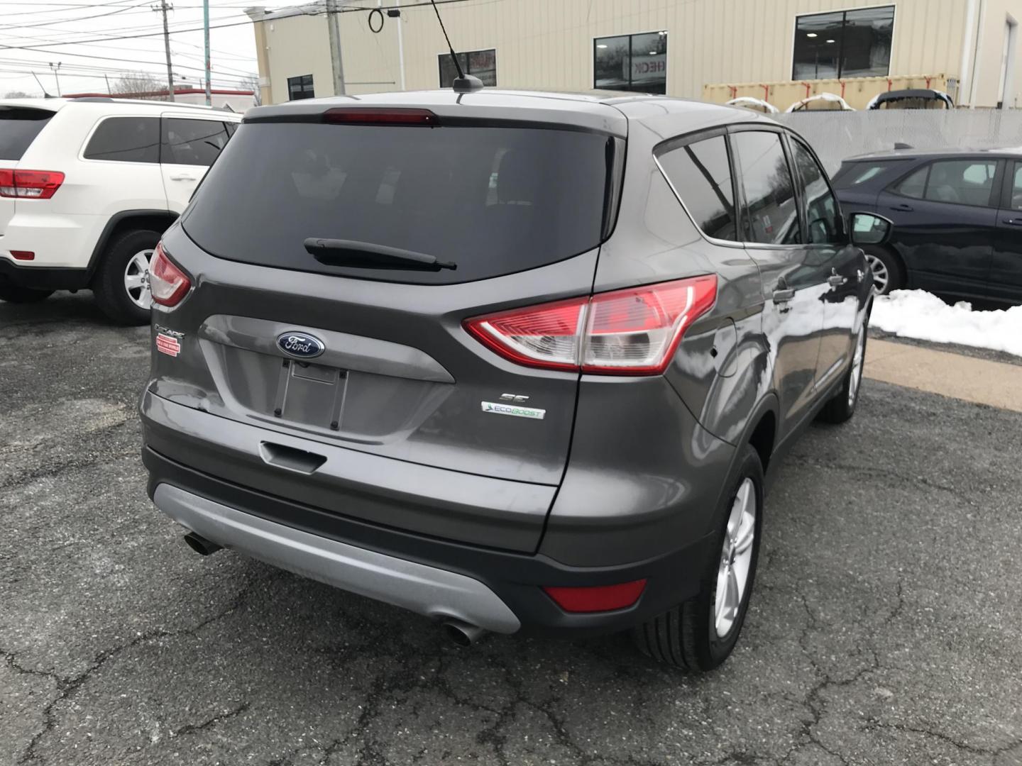 2014 Gray Ford Escape SE FWD (1FMCU0GX7EU) with an 1.6L L4 DOHC 16V engine, 6-Speed Automatic transmission, located at 577 Chester Pike, Prospect Park, PA, 19076, (610) 237-1015, 39.886154, -75.302338 - 2014 Ford Escape: Only 122k miles, great on gas, new PA inspection, SUPER CLEAN, runs LIKE NEW! This vehicle comes inspected and has been given a bumper to bumper safety check. It is very clean, reliable, and well maintained. We offer a unique pay plan that is known for being the easiest and fast - Photo#6