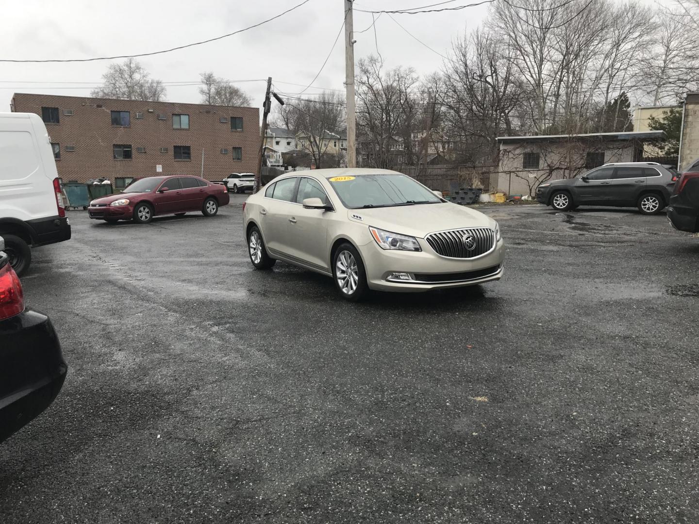 2015 Gold /Tan Buick LaCrosse Leather Package (1G4GB5G30FF) with an 3.6L V6 DOHC 24V FFV engine, 6-Speed Automatic transmission, located at 577 Chester Pike, Prospect Park, PA, 19076, (610) 237-1015, 39.886154, -75.302338 - Photo#1