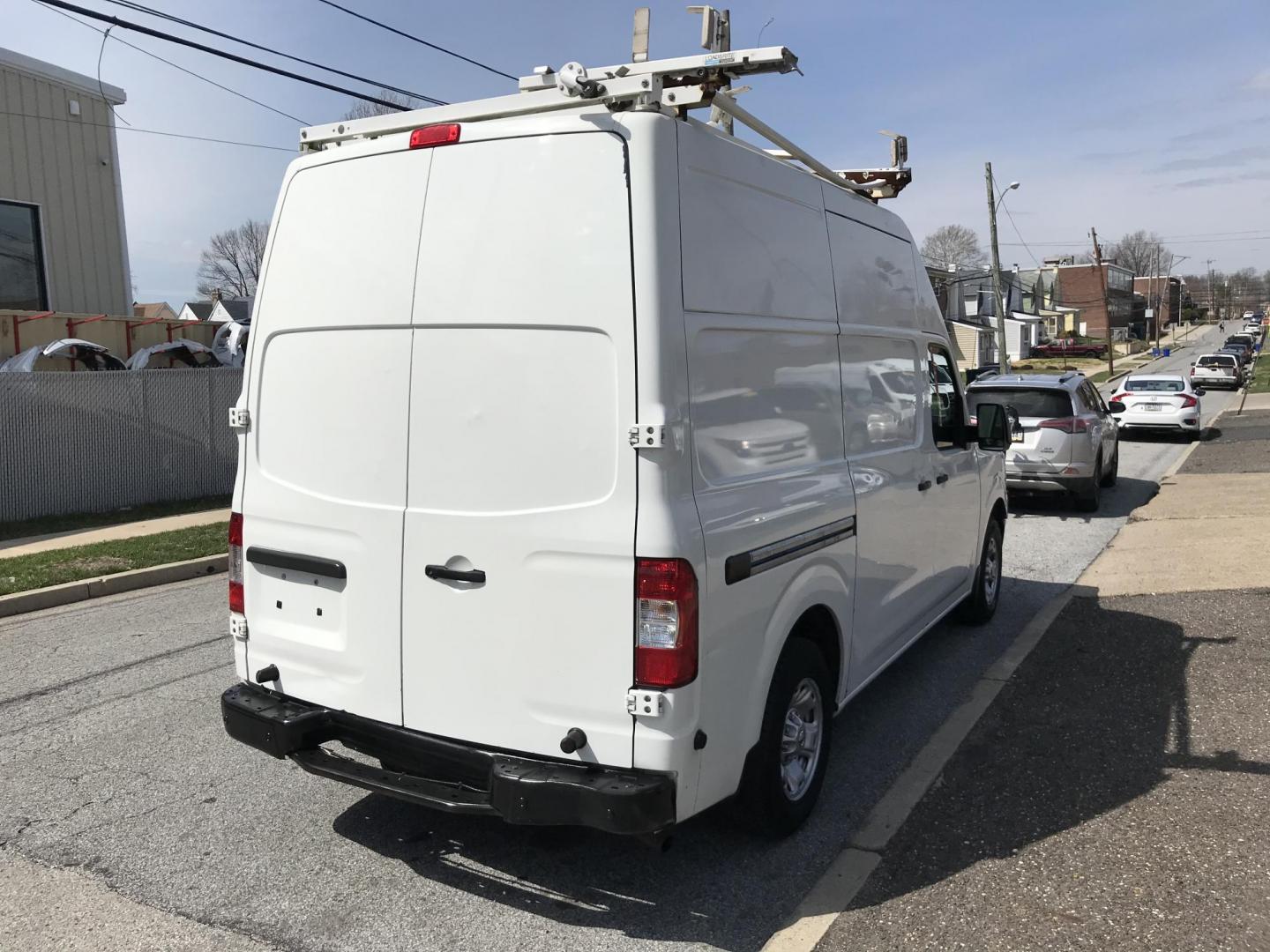 2016 White /Gray Nissan NV Cargo 2500 HD S V6 High Roof (1N6BF0LY5GN) with an 4.0L V6 engine, 5A transmission, located at 577 Chester Pike, Prospect Park, PA, 19076, (610) 237-1015, 39.886154, -75.302338 - 2016 Nissan NV 2500 High Roof: Only 123k miles, ladder racks, shelving, partition, new PA inspection, FLEET MAINTAINED! This vehicle comes inspected and has been given a bumper to bumper safety check. It is very clean, reliable, and well maintained. We offer a unique pay plan that is known for be - Photo#4