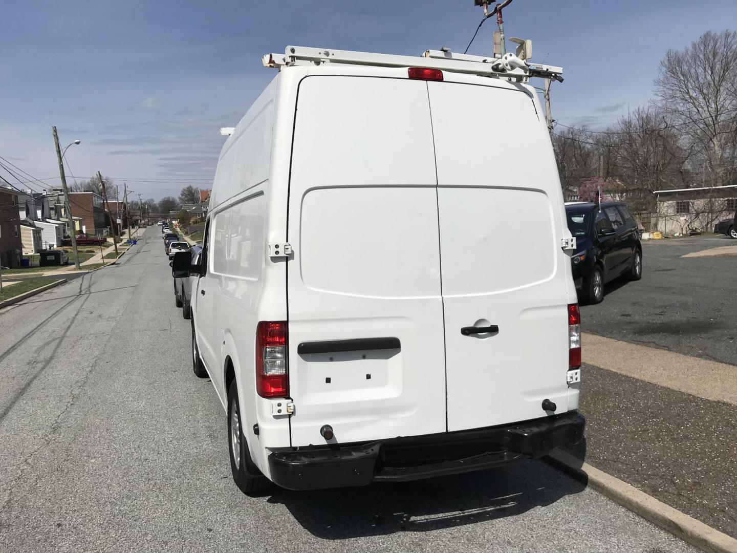 2016 White /Gray Nissan NV Cargo 2500 HD S V6 High Roof (1N6BF0LY5GN) with an 4.0L V6 engine, 5A transmission, located at 577 Chester Pike, Prospect Park, PA, 19076, (610) 237-1015, 39.886154, -75.302338 - 2016 Nissan NV 2500 High Roof: Only 123k miles, ladder racks, shelving, partition, new PA inspection, FLEET MAINTAINED! This vehicle comes inspected and has been given a bumper to bumper safety check. It is very clean, reliable, and well maintained. We offer a unique pay plan that is known for be - Photo#5