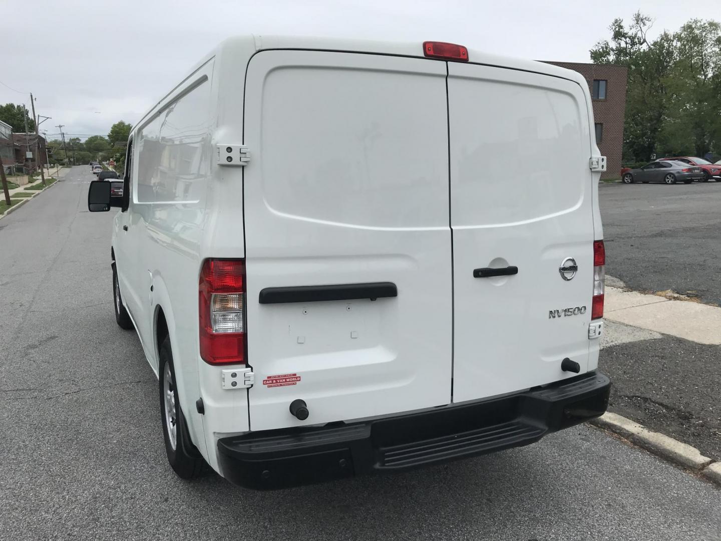 2019 White /Gray Nissan NV Cargo 1500 SV (1N6BF0KM6KN) with an 4.0L V6 engine, 5A transmission, located at 577 Chester Pike, Prospect Park, PA, 19076, (610) 237-1015, 39.886154, -75.302338 - 2019 Nissan NV 1500: Fleet maintained cargo van, shelving, backup camera, partition, no side or rear windows, runs LIKE NEW! This vehicle comes inspected and has been given a bumper to bumper safety check. It is very clean, reliable, and well maintained. We offer a unique pay plan that is known f - Photo#5