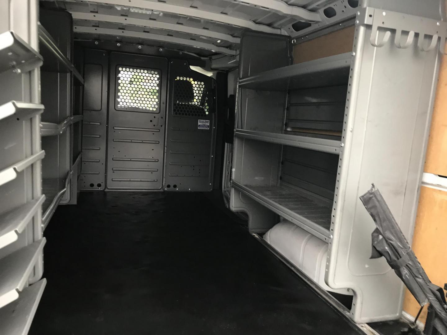 2019 White /Gray Nissan NV Cargo 1500 SV (1N6BF0KM6KN) with an 4.0L V6 engine, 5A transmission, located at 577 Chester Pike, Prospect Park, PA, 19076, (610) 237-1015, 39.886154, -75.302338 - 2019 Nissan NV 1500: Fleet maintained cargo van, shelving, backup camera, partition, no side or rear windows, runs LIKE NEW! This vehicle comes inspected and has been given a bumper to bumper safety check. It is very clean, reliable, and well maintained. We offer a unique pay plan that is known f - Photo#16