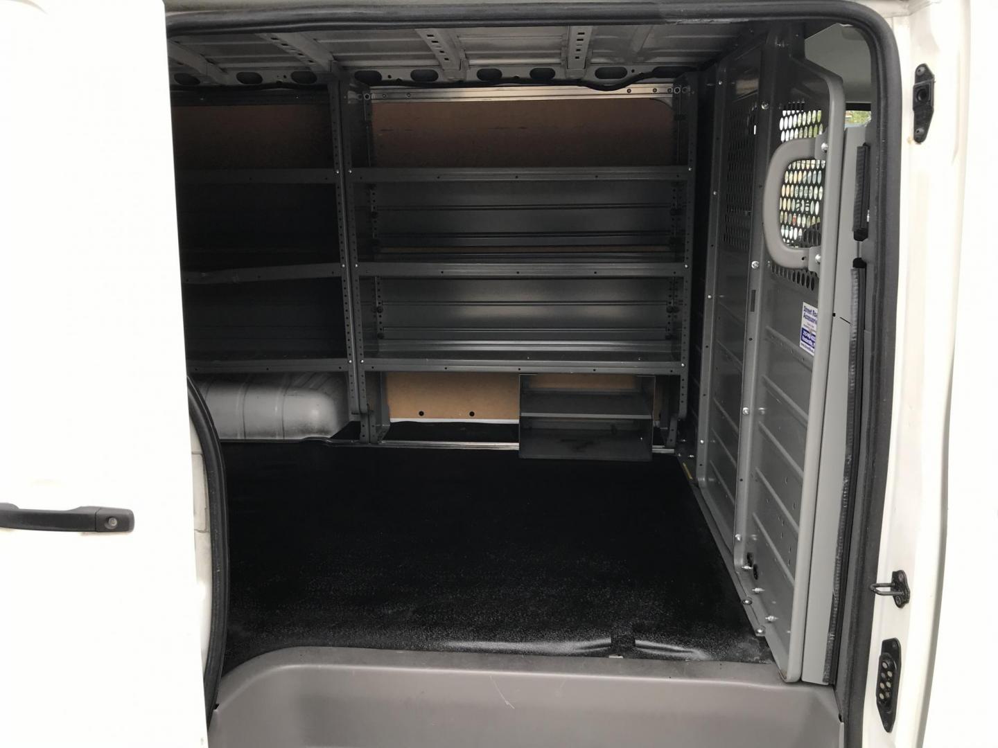 2019 White /Gray Nissan NV Cargo 1500 SV (1N6BF0KM6KN) with an 4.0L V6 engine, 5A transmission, located at 577 Chester Pike, Prospect Park, PA, 19076, (610) 237-1015, 39.886154, -75.302338 - 2019 Nissan NV 1500: Fleet maintained cargo van, shelving, backup camera, partition, no side or rear windows, runs LIKE NEW! This vehicle comes inspected and has been given a bumper to bumper safety check. It is very clean, reliable, and well maintained. We offer a unique pay plan that is known f - Photo#17