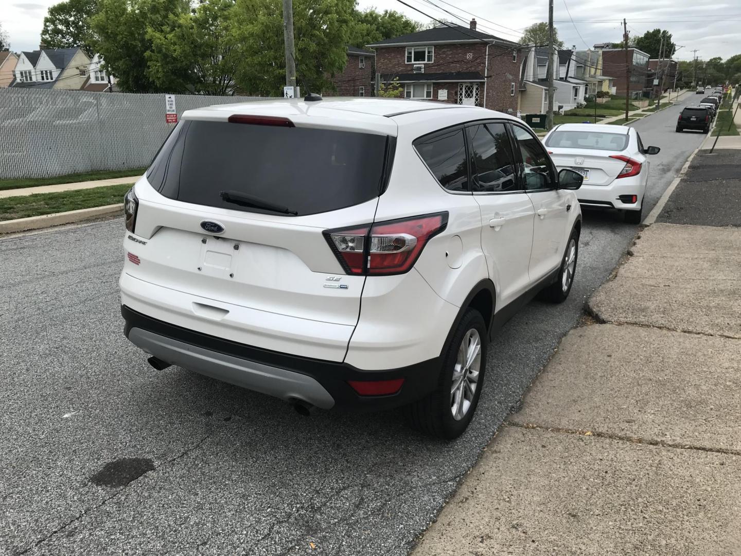 2017 White /Gray Ford Escape SE 4WD (1FMCU9GD6HU) with an 1.5L L4 DOHC 16V engine, 6A transmission, located at 577 Chester Pike, Prospect Park, PA, 19076, (610) 237-1015, 39.886154, -75.302338 - 2017 Ford Escape SE: 4x4, backup camera, new PA inspection, great on gas, SUPER CLEAN, runs LIKE NEW! This vehicle comes inspected and has been given a bumper to bumper safety check. It is very clean, reliable, and well maintained. We offer a unique pay plan that is known for being the easiest an - Photo#4