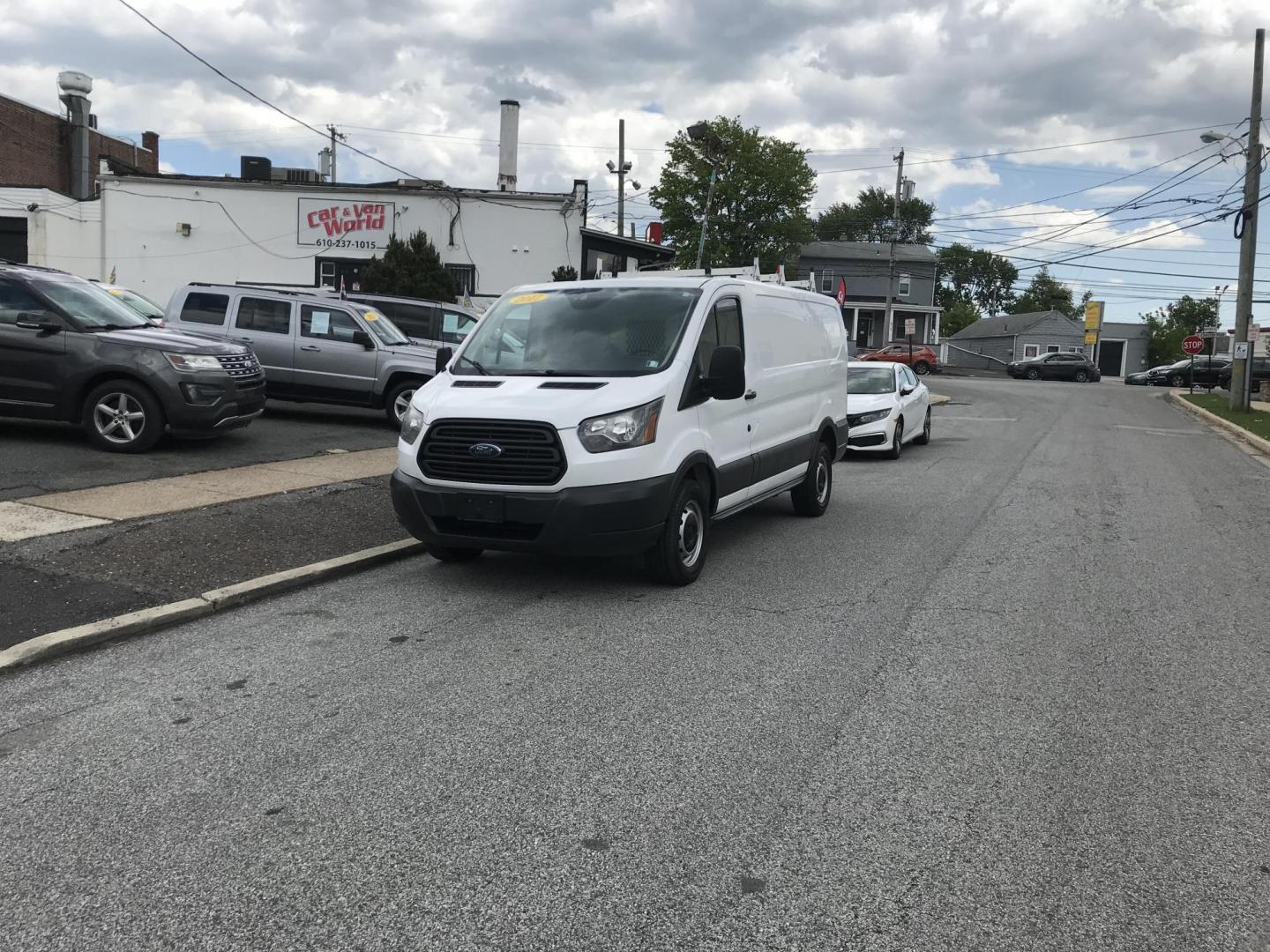 2017 White /Gray Ford Transit 250 Van Low Roof w/Sliding Pass. 130-in. WB (1FTYR1YM0HK) with an 3.7L V6 DOHC 24V engine, 6A transmission, located at 577 Chester Pike, Prospect Park, PA, 19076, (610) 237-1015, 39.886154, -75.302338 - 2017 Ford Transit 250: Ladder racks, shelving, no side or rear windows, backup camera, partition, FLEET MAINTAINED, runs LIKE NEW! This vehicle comes inspected and has been given a bumper to bumper safety check. It is very clean, reliable, and well maintained. We offer a unique pay plan that is k - Photo#1