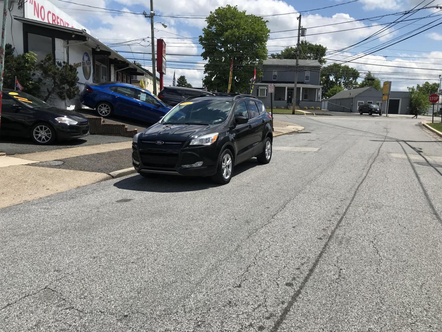 2015 Black /Gray Ford Escape SE 4WD (1FMCU9GX7FU) with an 1.6L L4 DOHC 16V engine, 6-Speed Automatic transmission, located at 577 Chester Pike, Prospect Park, PA, 19076, (610) 237-1015, 39.886154, -75.302338 - 2015 Ford Escape SE: Only 79k miles, 4x4, navigation system, backup camera, SUPER CLEAN, runs LIKE NEW! This vehicle comes inspected and has been given a bumper to bumper safety check. It is very clean, reliable, and well maintained. We offer a unique pay plan that is known for being the easiest - Photo#1