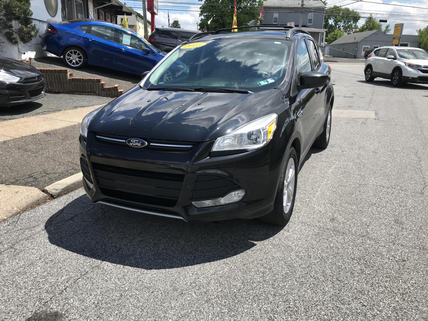 2015 Black /Gray Ford Escape SE 4WD (1FMCU9GX7FU) with an 1.6L L4 DOHC 16V engine, 6-Speed Automatic transmission, located at 577 Chester Pike, Prospect Park, PA, 19076, (610) 237-1015, 39.886154, -75.302338 - 2015 Ford Escape SE: Only 79k miles, 4x4, navigation system, backup camera, SUPER CLEAN, runs LIKE NEW! This vehicle comes inspected and has been given a bumper to bumper safety check. It is very clean, reliable, and well maintained. We offer a unique pay plan that is known for being the easiest - Photo#2