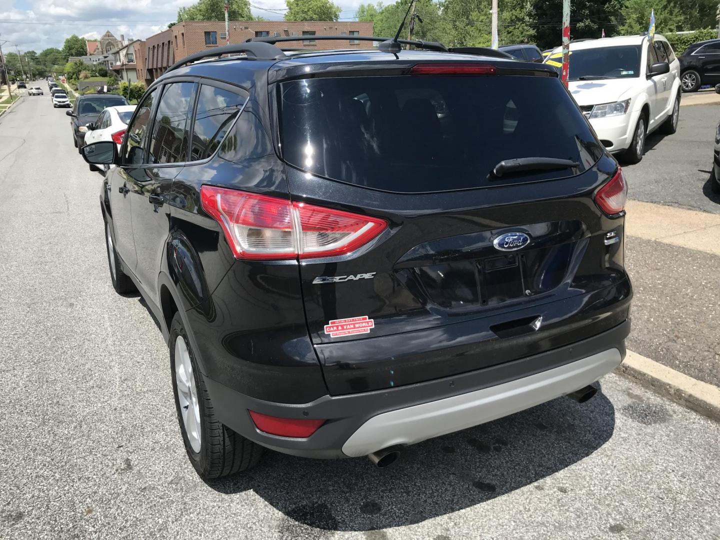2015 Black /Gray Ford Escape SE 4WD (1FMCU9GX7FU) with an 1.6L L4 DOHC 16V engine, 6-Speed Automatic transmission, located at 577 Chester Pike, Prospect Park, PA, 19076, (610) 237-1015, 39.886154, -75.302338 - 2015 Ford Escape SE: Only 79k miles, 4x4, navigation system, backup camera, SUPER CLEAN, runs LIKE NEW! This vehicle comes inspected and has been given a bumper to bumper safety check. It is very clean, reliable, and well maintained. We offer a unique pay plan that is known for being the easiest - Photo#5