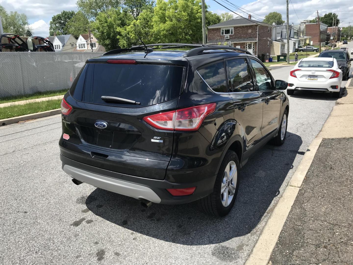 2015 Black /Gray Ford Escape SE 4WD (1FMCU9GX7FU) with an 1.6L L4 DOHC 16V engine, 6-Speed Automatic transmission, located at 577 Chester Pike, Prospect Park, PA, 19076, (610) 237-1015, 39.886154, -75.302338 - 2015 Ford Escape SE: Only 79k miles, 4x4, navigation system, backup camera, SUPER CLEAN, runs LIKE NEW! This vehicle comes inspected and has been given a bumper to bumper safety check. It is very clean, reliable, and well maintained. We offer a unique pay plan that is known for being the easiest - Photo#4