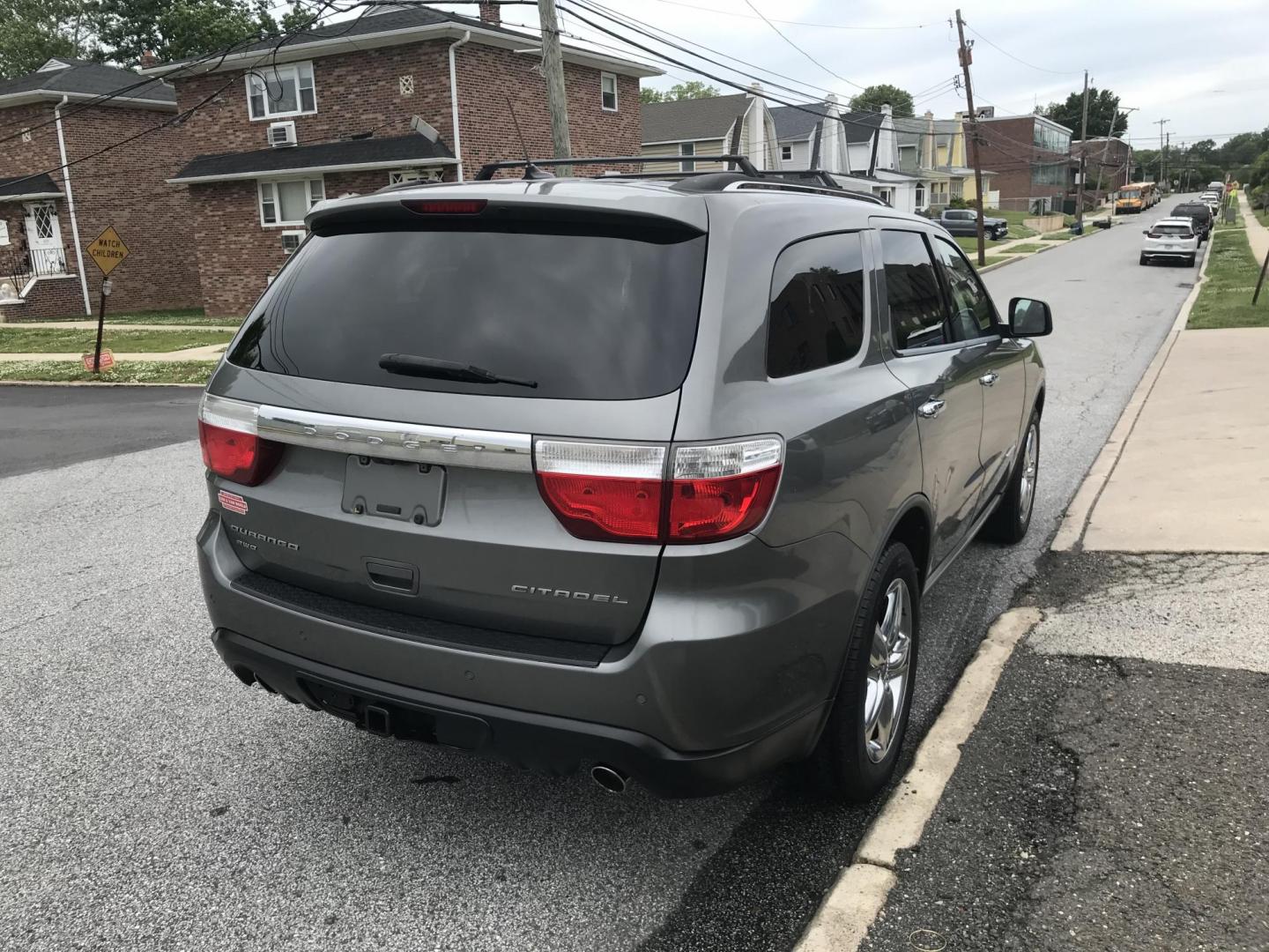 2012 Gray /Black Dodge Durango Citadel AWD (1C4SDJET7CC) with an 5.7L V8 OHV 16V engine, 5-Speed Automatic transmission, located at 577 Chester Pike, Prospect Park, PA, 19076, (610) 237-1015, 39.886154, -75.302338 - 2012 Dodge Durango Citadel: 3rd row seating, 4x4, backup camera, navigation system, DVD player, sunroof, new inspection, SUPER CLEAN, runs LIKE NEW! This vehicle comes inspected and has been given a bumper to bumper safety check. It is very clean, reliable, and well maintained. We offer a unique - Photo#4