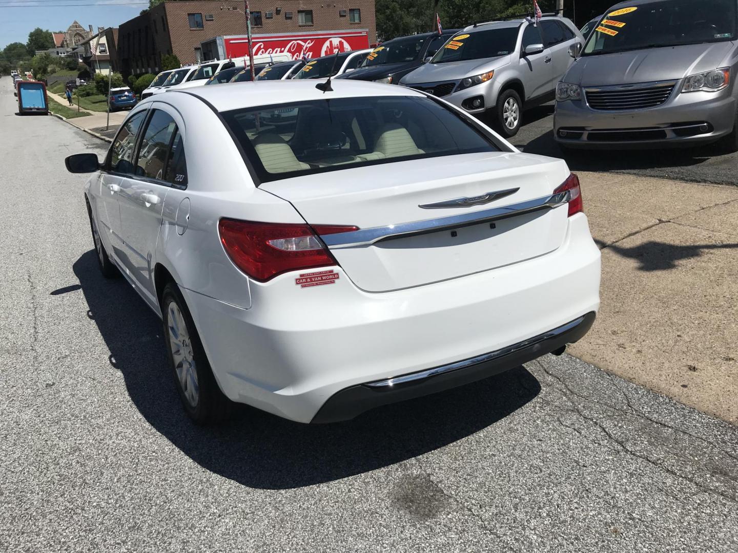 2014 White /Beige Chrysler 200 LX (1C3CCBAB9EN) with an 2.4L L4 DOHC 16V engine, 6-Speed Automatic transmission, located at 577 Chester Pike, Prospect Park, PA, 19076, (610) 237-1015, 39.886154, -75.302338 - 2014 Chrysler 200 LX: Only 102k miles, great on gas, new PA inspection, SUPER CLEAN, runs LIKE NEW! This vehicle comes inspected and has been given a bumper to bumper safety check. It is very clean, reliable, and well maintained. We offer a unique pay plan that is known for being the easiest and - Photo#5