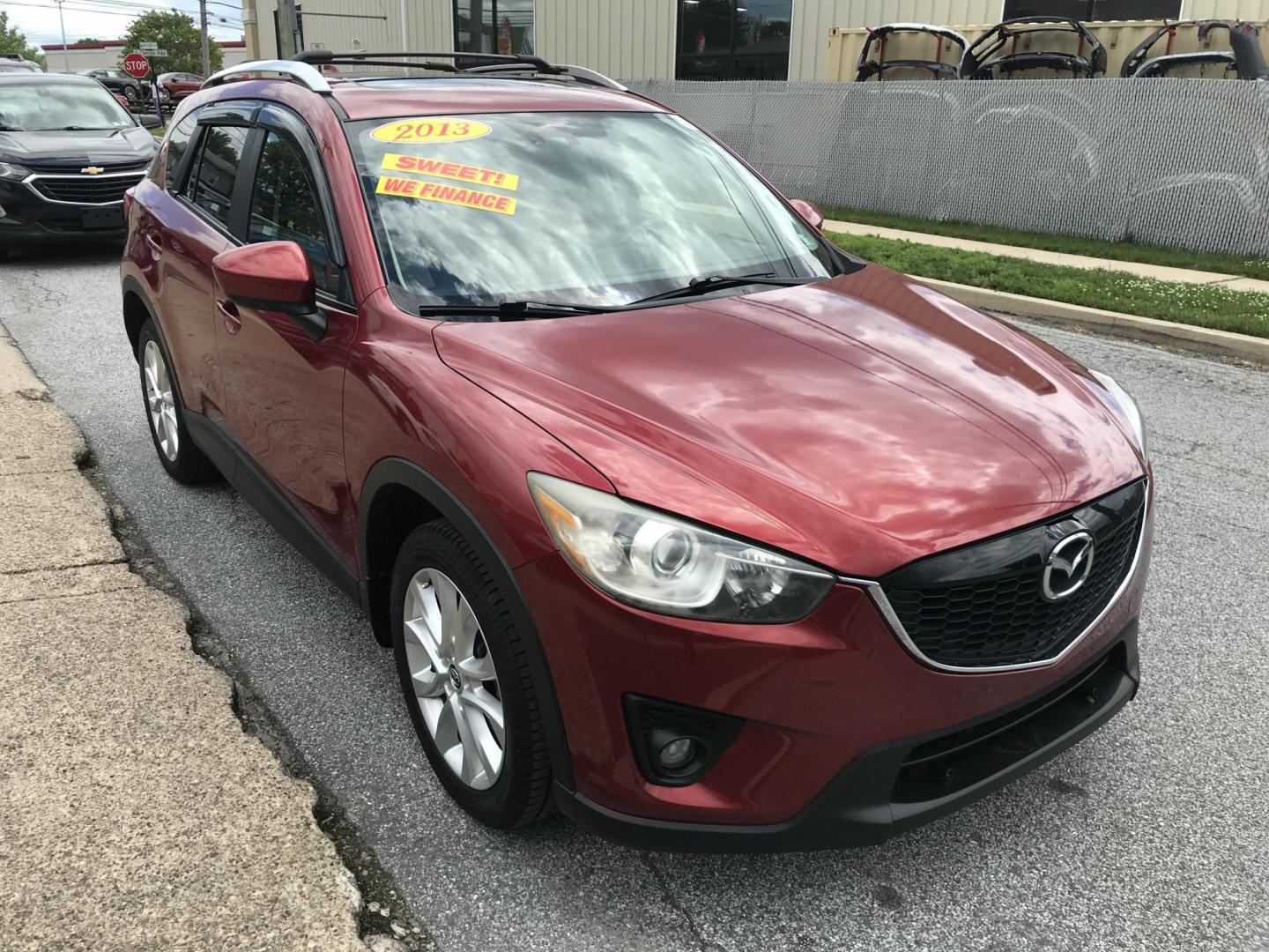 2013 Red /Tan Mazda CX-5 Grand Touring AWD (JM3KE4DE1D0) with an 2.0 V4 engine, 6-Speed Automatic transmission, located at 577 Chester Pike, Prospect Park, PA, 19076, (610) 237-1015, 39.886154, -75.302338 - 2013 Mazda CX-5 Grand Touring: AWD, navigation system, sunroof, backup camera, new PA inspection, SUPER CLEAN, runs LIKE NEW! This vehicle comes inspected and has been given a bumper to bumper safety check. It is very clean, reliable, and well maintained. We offer a unique pay plan that is known - Photo#3