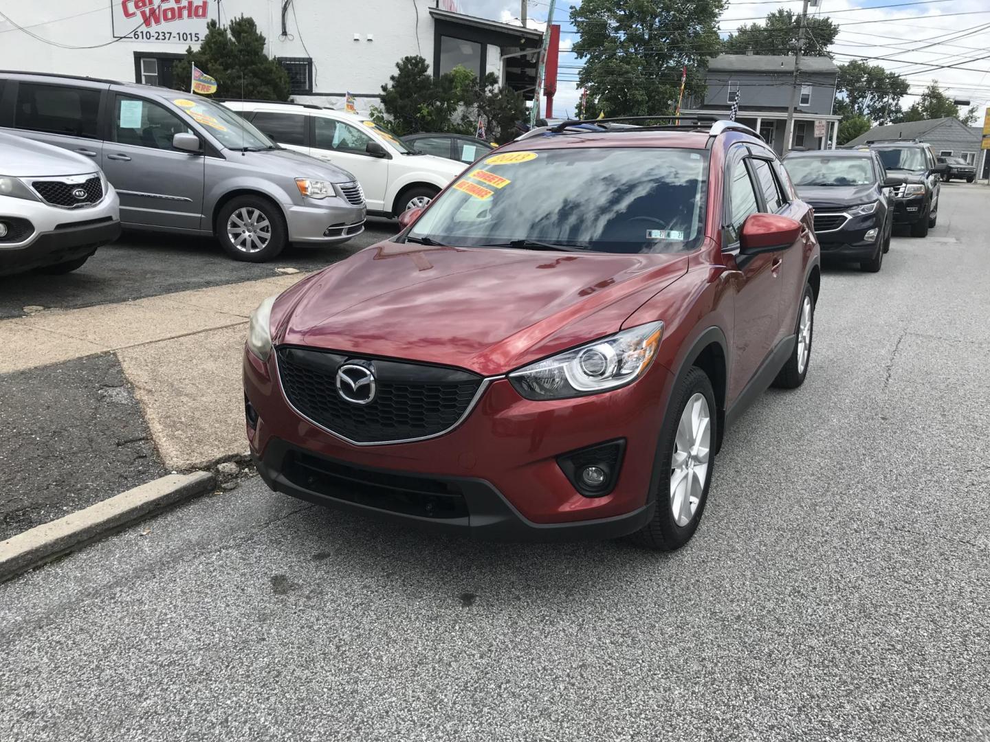 2013 Red /Tan Mazda CX-5 Grand Touring AWD (JM3KE4DE1D0) with an 2.0 V4 engine, 6-Speed Automatic transmission, located at 577 Chester Pike, Prospect Park, PA, 19076, (610) 237-1015, 39.886154, -75.302338 - 2013 Mazda CX-5 Grand Touring: AWD, navigation system, sunroof, backup camera, new PA inspection, SUPER CLEAN, runs LIKE NEW! This vehicle comes inspected and has been given a bumper to bumper safety check. It is very clean, reliable, and well maintained. We offer a unique pay plan that is known - Photo#2