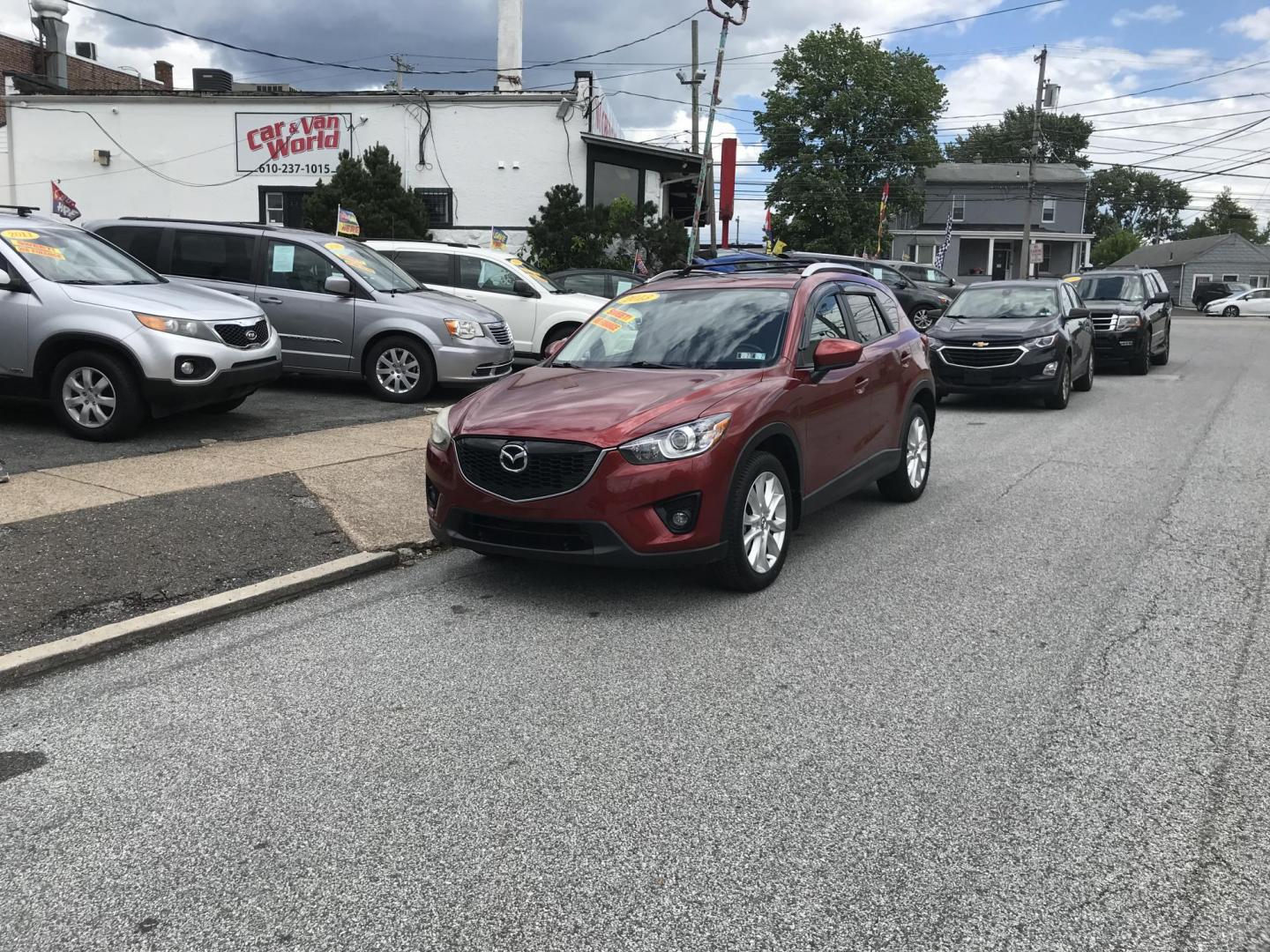 2013 Red /Tan Mazda CX-5 Grand Touring AWD (JM3KE4DE1D0) with an 2.0 V4 engine, 6-Speed Automatic transmission, located at 577 Chester Pike, Prospect Park, PA, 19076, (610) 237-1015, 39.886154, -75.302338 - 2013 Mazda CX-5 Grand Touring: AWD, navigation system, sunroof, backup camera, new PA inspection, SUPER CLEAN, runs LIKE NEW! This vehicle comes inspected and has been given a bumper to bumper safety check. It is very clean, reliable, and well maintained. We offer a unique pay plan that is known - Photo#1