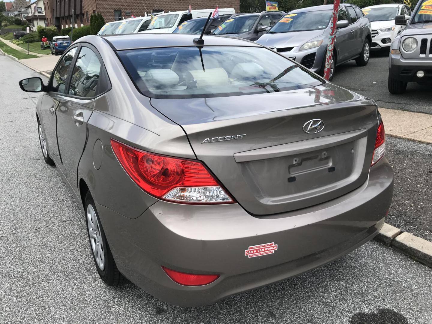 2014 Gold /Tan Hyundai Accent GLS 4-Door (KMHCT4AE6EU) with an 1.6L L4 DOHC 16V engine, Automatic transmission, located at 577 Chester Pike, Prospect Park, PA, 19076, (610) 237-1015, 39.886154, -75.302338 - 2014 Hyundai Accent: Great on gas, new PA inspection, runs EXCELLENT! This vehicle comes inspected and has been given a bumper to bumper safety check. It is very clean, reliable, and well maintained. We offer a unique pay plan that is known for being the easiest and fastest financing option in th - Photo#5
