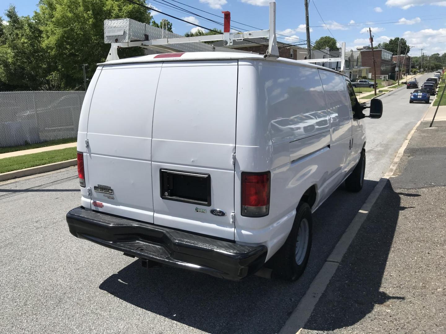 2014 White /Gray Ford E-Series Van E-350 Super Duty (1FTSE3EL4ED) with an 5.4L V8 SOHC 16V FFV engine, 4-Speed Automatic transmission, located at 577 Chester Pike, Prospect Park, PA, 19076, (610) 237-1015, 39.886154, -75.302338 - 2014 Ford Econoline E350: Only 139k miles, ladder racks, shelving, no side or rear windows, partition, new PA inspection, RUNS LIKE NEW! This vehicle comes inspected and has been given a bumper to bumper safety check. It is very clean, reliable, and well maintained. We offer a unique pay plan tha - Photo#4