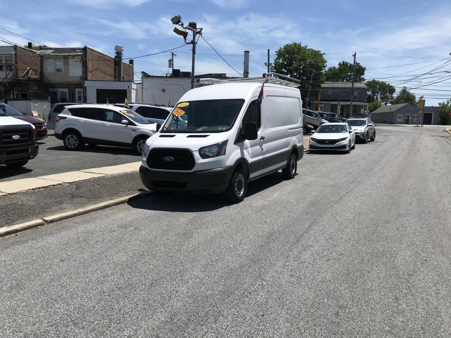 2018 White /Gray Ford Transit 250 Van Med. Roof w/Sliding Pass. 130-in. WB (1FTYR1CM8JK) with an 3.7L V6 DOHC 24V engine, 6A transmission, located at 577 Chester Pike, Prospect Park, PA, 19076, (610) 237-1015, 39.886154, -75.302338 - 2018 Ford Transit 250 Medium Roof: Ladder racks, shelving, cages over rear windows, backup camera, new PA inspection, FLEET MAINTAINED, runs LIKE NEW! This vehicle comes inspected and has been given a bumper to bumper safety check. It is very clean, reliable, and well maintained. We offer a uniqu - Photo#1