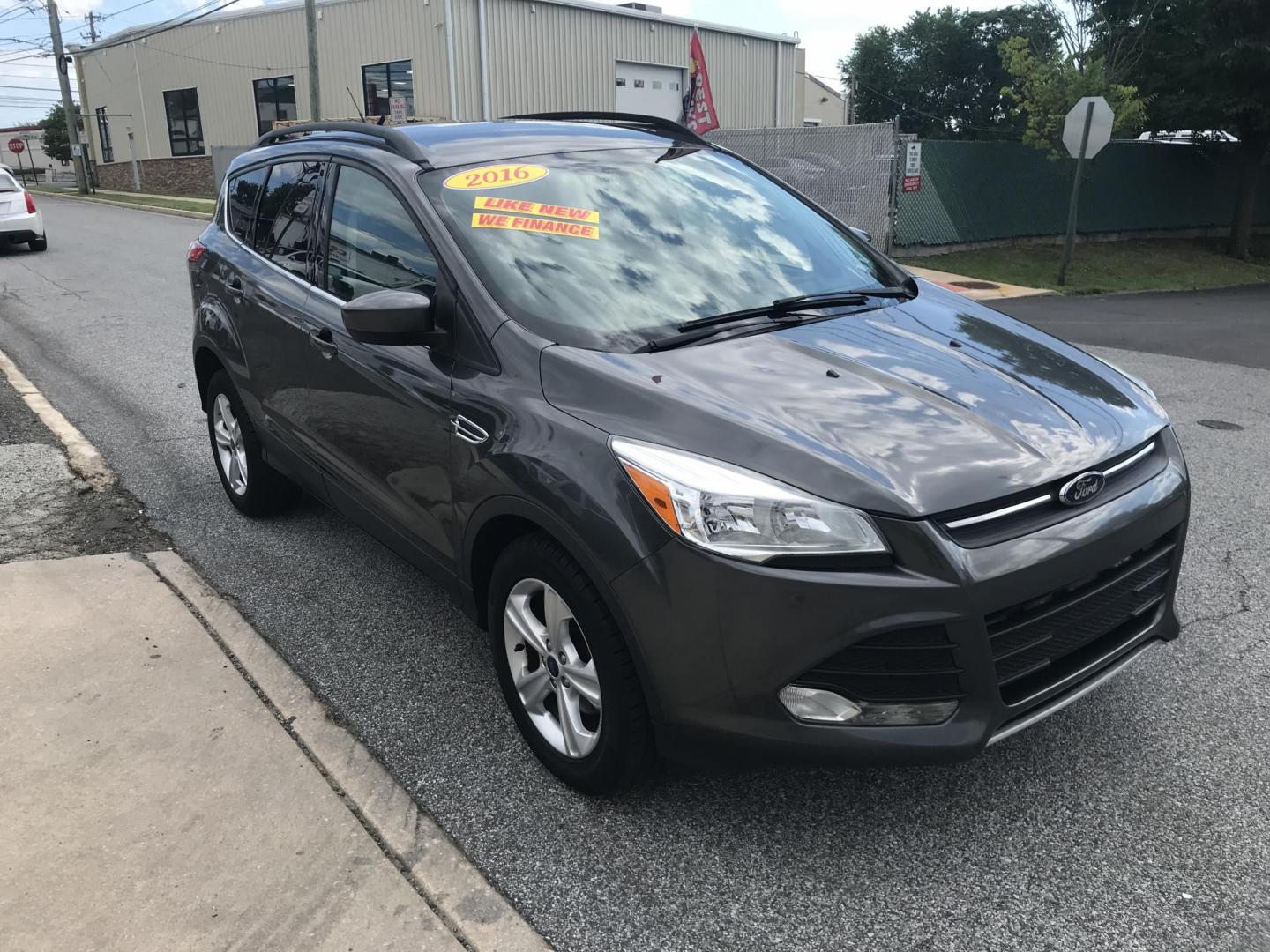 2016 Gray /Gray Ford Escape SE (1FMCU0GX3GU) with an 1.6L L4 DOHC 16V engine, 6-Speed Automatic transmission, located at 577 Chester Pike, Prospect Park, PA, 19076, (610) 237-1015, 39.886154, -75.302338 - 2016 Ford Escape SE: Only 108k miles, new PA inspection, backup camera, SUPER CLEAN, runs LIKE NEW! This vehicle comes inspected and has been given a bumper to bumper safety check. It is very clean, reliable, and well maintained. We offer a unique pay plan that is known for being the easiest and- Photo#3