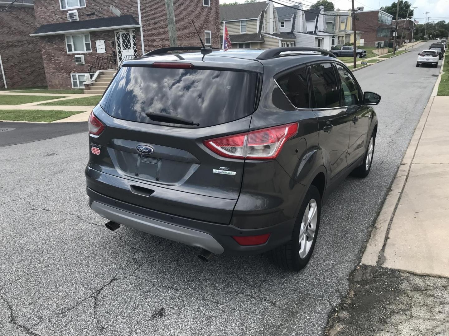 2016 Gray /Gray Ford Escape SE (1FMCU0GX3GU) with an 1.6L L4 DOHC 16V engine, 6-Speed Automatic transmission, located at 577 Chester Pike, Prospect Park, PA, 19076, (610) 237-1015, 39.886154, -75.302338 - 2016 Ford Escape SE: Only 108k miles, new PA inspection, backup camera, SUPER CLEAN, runs LIKE NEW! This vehicle comes inspected and has been given a bumper to bumper safety check. It is very clean, reliable, and well maintained. We offer a unique pay plan that is known for being the easiest and- Photo#4
