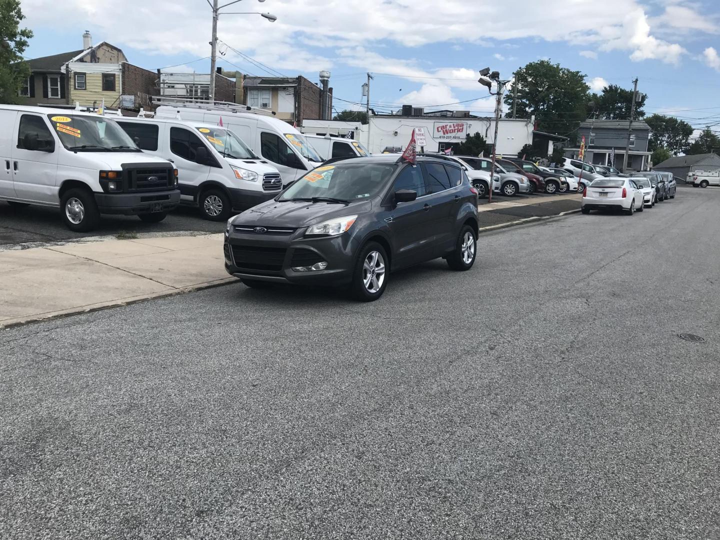 2016 Gray /Gray Ford Escape SE (1FMCU0GX3GU) with an 1.6L L4 DOHC 16V engine, 6-Speed Automatic transmission, located at 577 Chester Pike, Prospect Park, PA, 19076, (610) 237-1015, 39.886154, -75.302338 - 2016 Ford Escape SE: Only 108k miles, new PA inspection, backup camera, SUPER CLEAN, runs LIKE NEW! This vehicle comes inspected and has been given a bumper to bumper safety check. It is very clean, reliable, and well maintained. We offer a unique pay plan that is known for being the easiest and- Photo#1