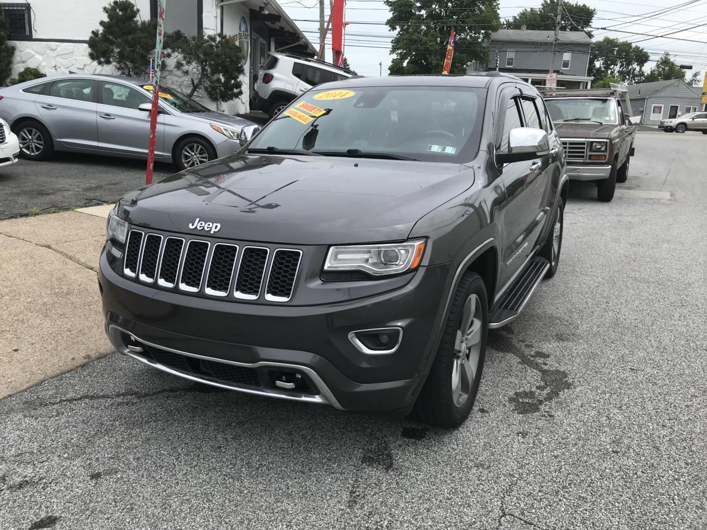 2014 Gray /Black Jeep Grand Cherokee Overland 4WD (1C4RJFCG3EC) with an 3.6L V6 DOHC 24V engine, 5-Speed Automatic transmission, located at 577 Chester Pike, Prospect Park, PA, 19076, (610) 237-1015, 39.886154, -75.302338 - 2014 Jeep Grand Cherokee Overland: 4x4, backup camera, navigation system, sunroof, new PA inspection, SUPER CLEAN, runs LIKE NEW! This vehicle comes inspected and has been given a bumper to bumper safety check. I4 is very clean, reliable, and well maintained. We offer a unique pay plan that is kn - Photo#2