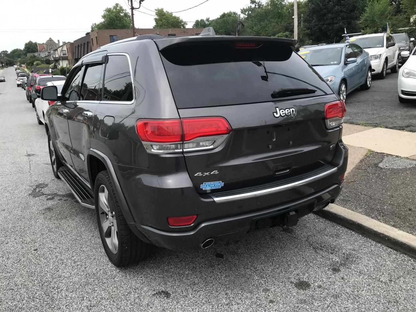 2014 Gray /Black Jeep Grand Cherokee Overland 4WD (1C4RJFCG3EC) with an 3.6L V6 DOHC 24V engine, 5-Speed Automatic transmission, located at 577 Chester Pike, Prospect Park, PA, 19076, (610) 237-1015, 39.886154, -75.302338 - 2014 Jeep Grand Cherokee Overland: 4x4, backup camera, navigation system, sunroof, new PA inspection, SUPER CLEAN, runs LIKE NEW! This vehicle comes inspected and has been given a bumper to bumper safety check. I4 is very clean, reliable, and well maintained. We offer a unique pay plan that is kn - Photo#5
