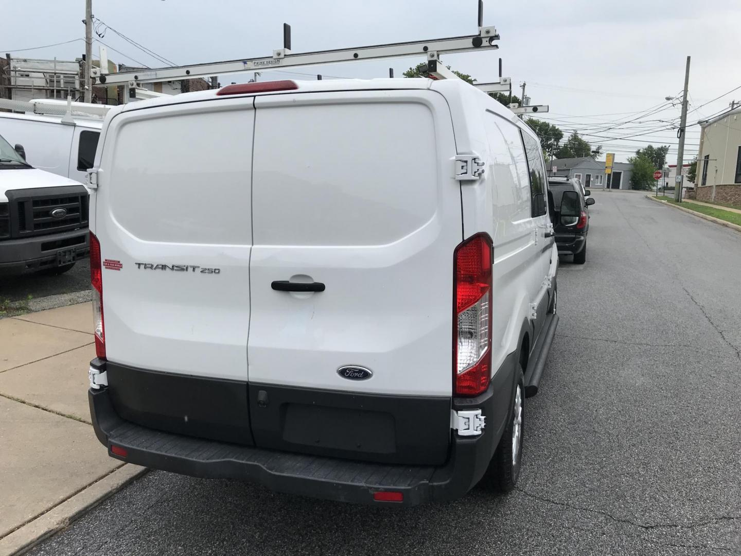 2016 White /Gray Ford Transit 250 Van Low Roof 60/40 Pass.130-in. WB (1FTYR1ZM8GK) with an 3.7L V6 DOHC 24V engine, 6A transmission, located at 577 Chester Pike, Prospect Park, PA, 19076, (610) 237-1015, 39.886154, -75.302338 - 2016 Ford Transit 250: Ladder racks, shelving, backup camera, new PA inspection, FLEET MAINTAINED, runs LIKE NEW! This vehicle comes inspected and has been given a bumper to bumper safety check. It is very clean, reliable, and well maintained. We offer a unique pay plan that is known for being th - Photo#5