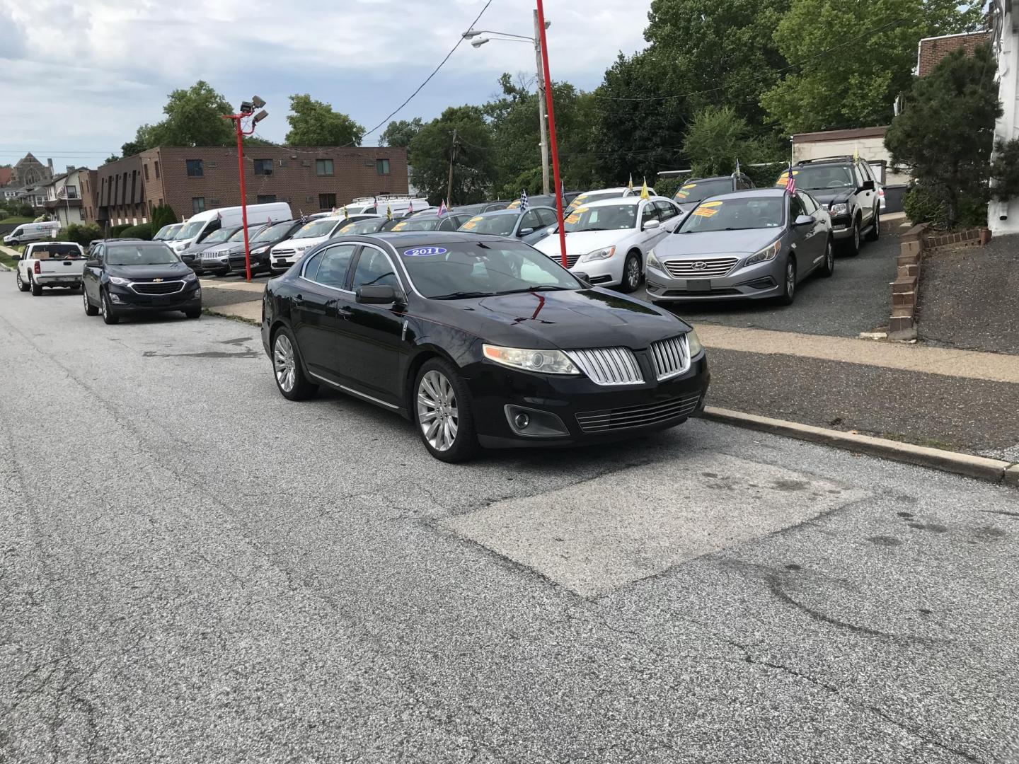 2011 Black /Black Lincoln MKS 3.5L with EcoBoost AWD (1LNHL9FT4BG) with an 3.5L V6 DOHC 24V engine, 6-Speed Automatic transmission, located at 577 Chester Pike, Prospect Park, PA, 19076, (610) 237-1015, 39.886154, -75.302338 - 2011 Lincoln MKS: Navigation system, AWD, backup camera, new PA inspection, SUPER CLEAN, runs LIKE NEW! This vehicle comes inspected and has been given a bumper to bumper safety check. It is very clean, reliable, and well maintained. We offer a unique pay plan that is known for being the easiest- Photo#1