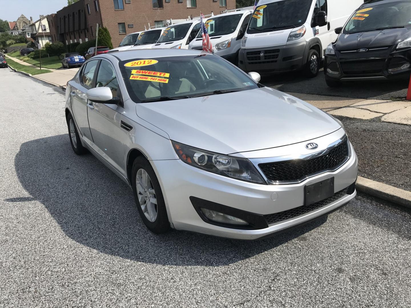 2012 Silver /Gray Kia Optima LX MT (KNAGM4A77C5) with an 2.4L L4 DOHC 16V engine, Automatic transmission, located at 577 Chester Pike, Prospect Park, PA, 19076, (610) 237-1015, 39.886154, -75.302338 - 2012 Kia Optima LX: Only 101k miles, great on gas, new PA inspection, SUPER CLEAN, runs LIKE NEW! This vehicle comes inspected and has been given a bumper to bumper safety check. It is very clean, reliable, and well maintained. We offer a unique pay plan that is known for being the easiest and fa- Photo#2