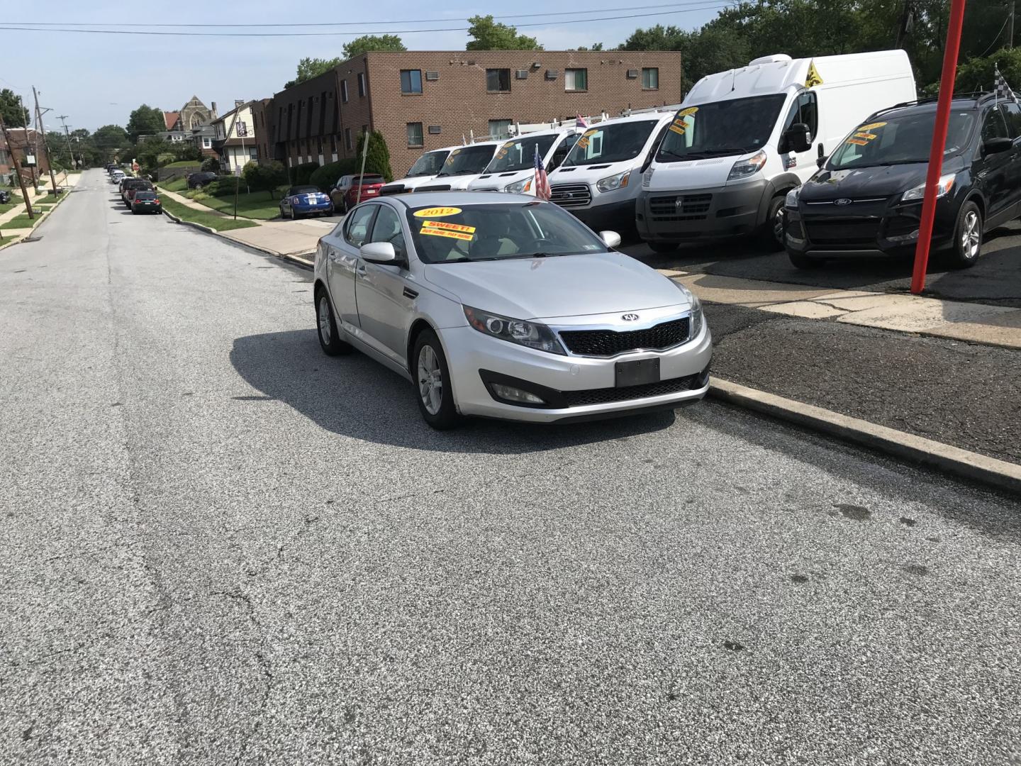 2012 Silver /Gray Kia Optima LX MT (KNAGM4A77C5) with an 2.4L L4 DOHC 16V engine, Automatic transmission, located at 577 Chester Pike, Prospect Park, PA, 19076, (610) 237-1015, 39.886154, -75.302338 - 2012 Kia Optima LX: Only 101k miles, great on gas, new PA inspection, SUPER CLEAN, runs LIKE NEW! This vehicle comes inspected and has been given a bumper to bumper safety check. It is very clean, reliable, and well maintained. We offer a unique pay plan that is known for being the easiest and fa- Photo#1