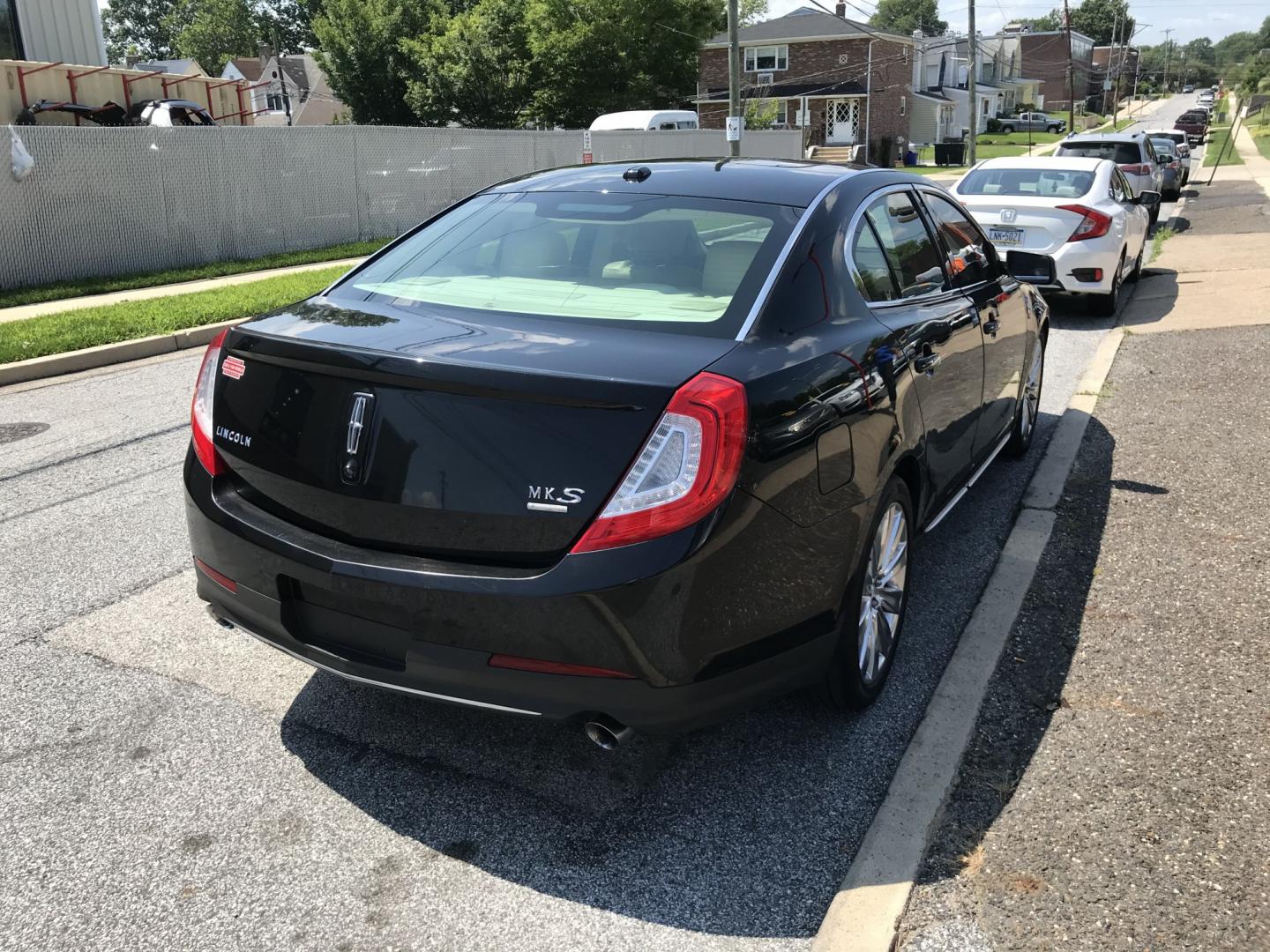 2013 Black /Tan Lincoln MKS EcoBoost AWD (1LNHL9FT6DG) with an 3.5L V6 DOHC 24V engine, 6-Speed Automatic transmission, located at 577 Chester Pike, Prospect Park, PA, 19076, (610) 237-1015, 39.886154, -75.302338 - 2013 Lincoln MKS AWD 118k miles • New PA Inspection. Example Financing: • $2,500 Down • $100 Weekly • $200 Bi-Weekly We finance our own vehicles. We do not obtain or review traditional consumer credit reports. Financing decisions are based on verified income, ability to repay, and our- Photo#4