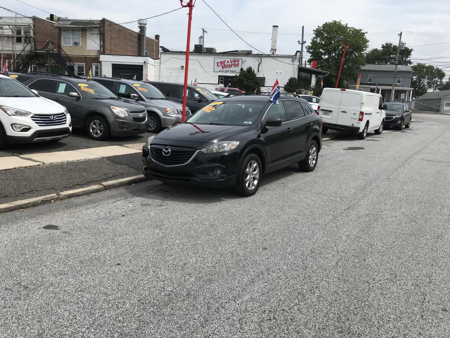 2015 Black /Black Mazda CX-9 Touring AWD (JM3TB3CV5F0) with an 3.7L V6 DOHC 24V engine, 6A transmission, located at 577 Chester Pike, Prospect Park, PA, 19076, (610) 237-1015, 39.886154, -75.302338 - 2015 Mazda CX-9 AWD 133k miles 3rd Row Seating Example Financing: • $3,000 Down • $100 Weekly • $200 Bi-Weekly We finance our own vehicles. We do not obtain or review traditional consumer credit reports. Financing decisions are based on verified income, ability to repay, and our in-house- Photo#1