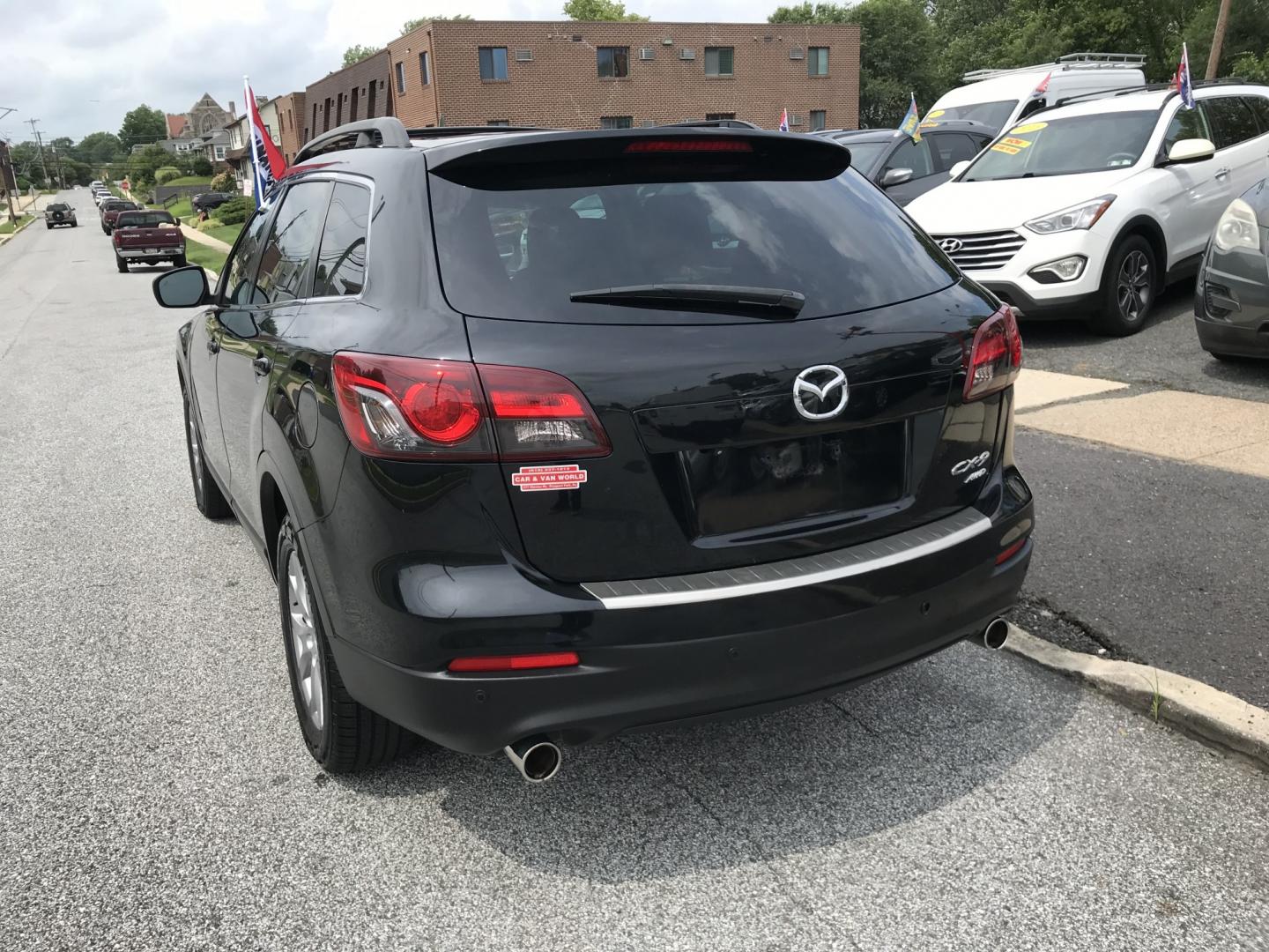 2015 Black /Black Mazda CX-9 Touring AWD (JM3TB3CV5F0) with an 3.7L V6 DOHC 24V engine, 6A transmission, located at 577 Chester Pike, Prospect Park, PA, 19076, (610) 237-1015, 39.886154, -75.302338 - 2015 Mazda CX-9 AWD 133k miles 3rd Row Seating Example Financing: • $3,000 Down • $100 Weekly • $200 Bi-Weekly We finance our own vehicles. We do not obtain or review traditional consumer credit reports. Financing decisions are based on verified income, ability to repay, and our in-house- Photo#5