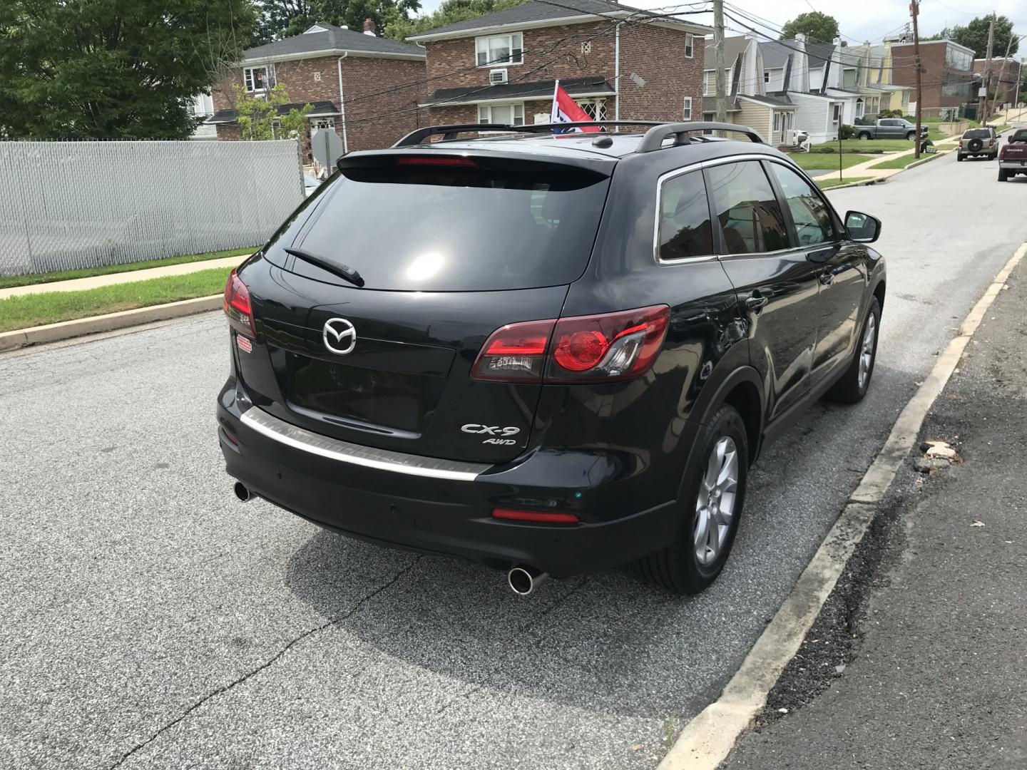 2015 Black /Black Mazda CX-9 Touring AWD (JM3TB3CV5F0) with an 3.7L V6 DOHC 24V engine, 6A transmission, located at 577 Chester Pike, Prospect Park, PA, 19076, (610) 237-1015, 39.886154, -75.302338 - 2015 Mazda CX-9 AWD 133k miles 3rd Row Seating Example Financing: • $3,000 Down • $100 Weekly • $200 Bi-Weekly We finance our own vehicles. We do not obtain or review traditional consumer credit reports. Financing decisions are based on verified income, ability to repay, and our in-house- Photo#4