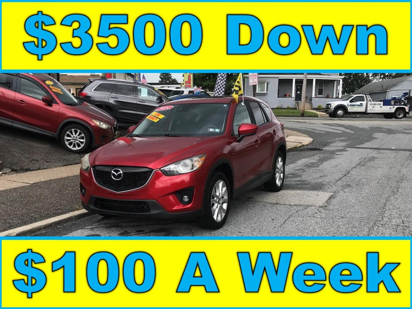 2014 Red /Black Mazda CX-5 Grand Touring AWD (JM3KE4DY3E0) with an 2.5L L4 DOHC 16V engine, 6A transmission, located at 577 Chester Pike, Prospect Park, PA, 19076, (610) 237-1015, 39.886154, -75.302338 - 2014 Mazda CX-5 Grand Touring: AWD, navigation system, backup camera, new PA inspection, SUPER CLEAN, runs LIKE NEW! This vehicle comes inspected and has been given a bumper to bumper safety check. It is very clean, reliable, and well maintained. We offer a unique pay plan that is known for being- Photo#0