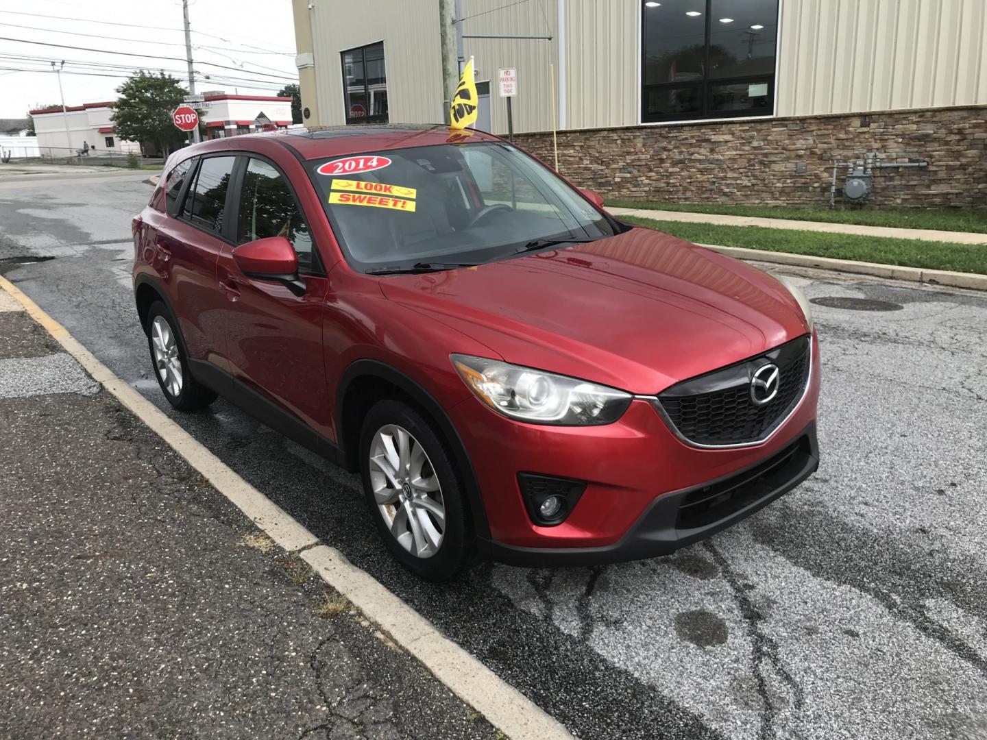 2014 Red /Black Mazda CX-5 Grand Touring AWD (JM3KE4DY3E0) with an 2.5L L4 DOHC 16V engine, 6A transmission, located at 577 Chester Pike, Prospect Park, PA, 19076, (610) 237-1015, 39.886154, -75.302338 - 2014 Mazda CX-5 Grand Touring: AWD, navigation system, backup camera, new PA inspection, SUPER CLEAN, runs LIKE NEW! This vehicle comes inspected and has been given a bumper to bumper safety check. It is very clean, reliable, and well maintained. We offer a unique pay plan that is known for being- Photo#3