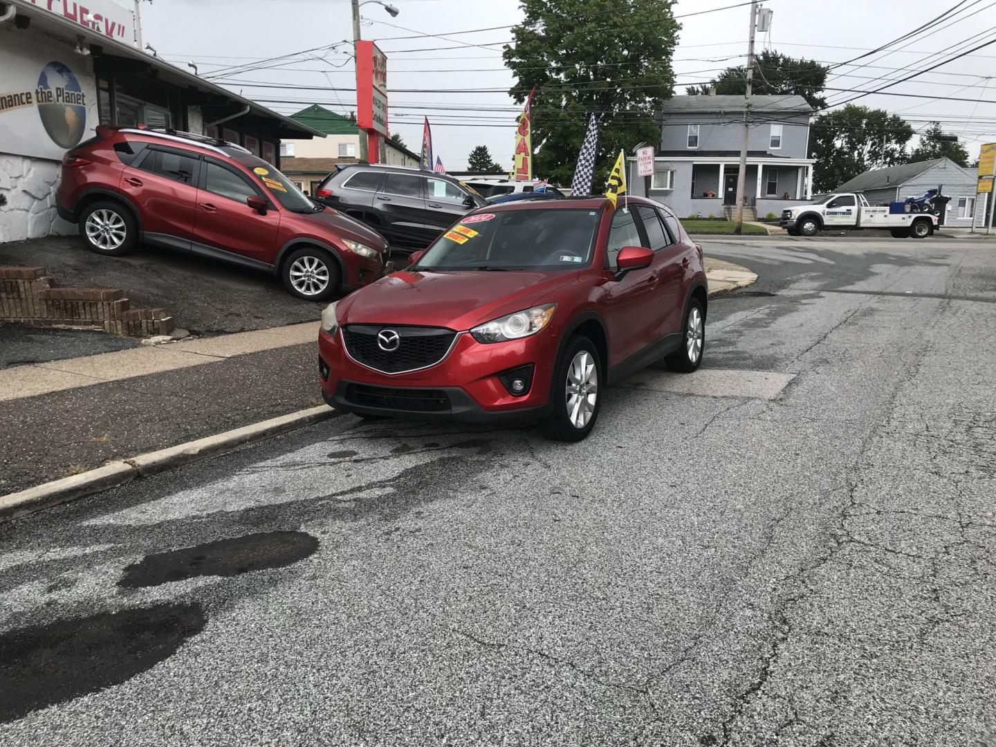 2014 Red /Black Mazda CX-5 Grand Touring AWD (JM3KE4DY3E0) with an 2.5L L4 DOHC 16V engine, 6A transmission, located at 577 Chester Pike, Prospect Park, PA, 19076, (610) 237-1015, 39.886154, -75.302338 - 2014 Mazda CX-5 Grand Touring: AWD, navigation system, backup camera, new PA inspection, SUPER CLEAN, runs LIKE NEW! This vehicle comes inspected and has been given a bumper to bumper safety check. It is very clean, reliable, and well maintained. We offer a unique pay plan that is known for being- Photo#1