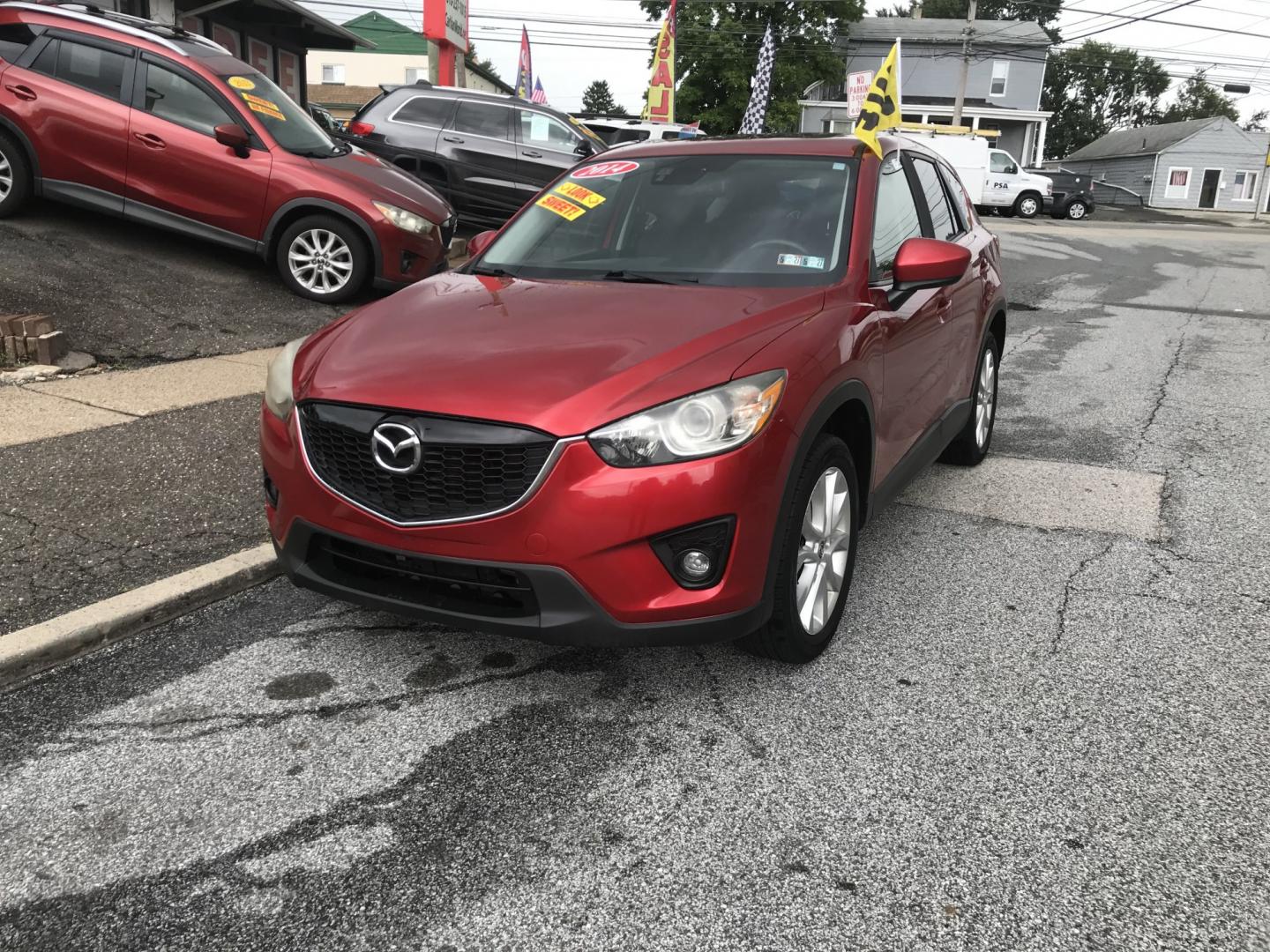 2014 Red /Black Mazda CX-5 Grand Touring AWD (JM3KE4DY3E0) with an 2.5L L4 DOHC 16V engine, 6A transmission, located at 577 Chester Pike, Prospect Park, PA, 19076, (610) 237-1015, 39.886154, -75.302338 - 2014 Mazda CX-5 Grand Touring: AWD, navigation system, backup camera, new PA inspection, SUPER CLEAN, runs LIKE NEW! This vehicle comes inspected and has been given a bumper to bumper safety check. It is very clean, reliable, and well maintained. We offer a unique pay plan that is known for being- Photo#2