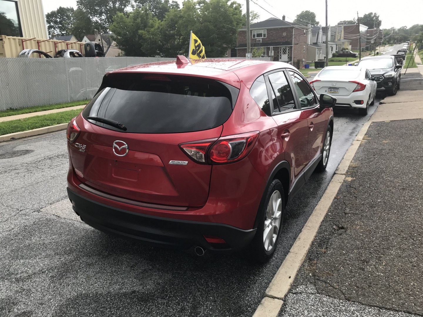 2014 Red /Black Mazda CX-5 Grand Touring AWD (JM3KE4DY3E0) with an 2.5L L4 DOHC 16V engine, 6A transmission, located at 577 Chester Pike, Prospect Park, PA, 19076, (610) 237-1015, 39.886154, -75.302338 - 2014 Mazda CX-5 Grand Touring: AWD, navigation system, backup camera, new PA inspection, SUPER CLEAN, runs LIKE NEW! This vehicle comes inspected and has been given a bumper to bumper safety check. It is very clean, reliable, and well maintained. We offer a unique pay plan that is known for being- Photo#4