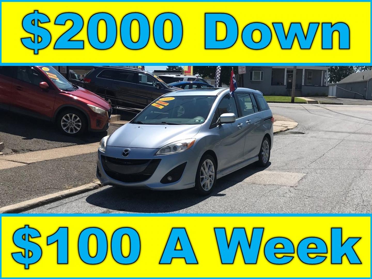 2012 Blue /Gray Mazda MAZDA5 Touring (JM1CW2CL5C0) with an 2.5L L4 DOHC 16V engine, 5-Speed Automatic transmission, located at 577 Chester Pike, Prospect Park, PA, 19076, (610) 237-1015, 39.886154, -75.302338 - 2012 Mazda 5 Touring: 3rd row seating, only 129k miles, new PA inspection, great on gas, runs LIKE NEW! This vehicle comes inspected and has been given a bumper to bumper safety check. It is very clean, reliable, and well maintained. We offer a unique pay plan that is known for being the easiest- Photo#0