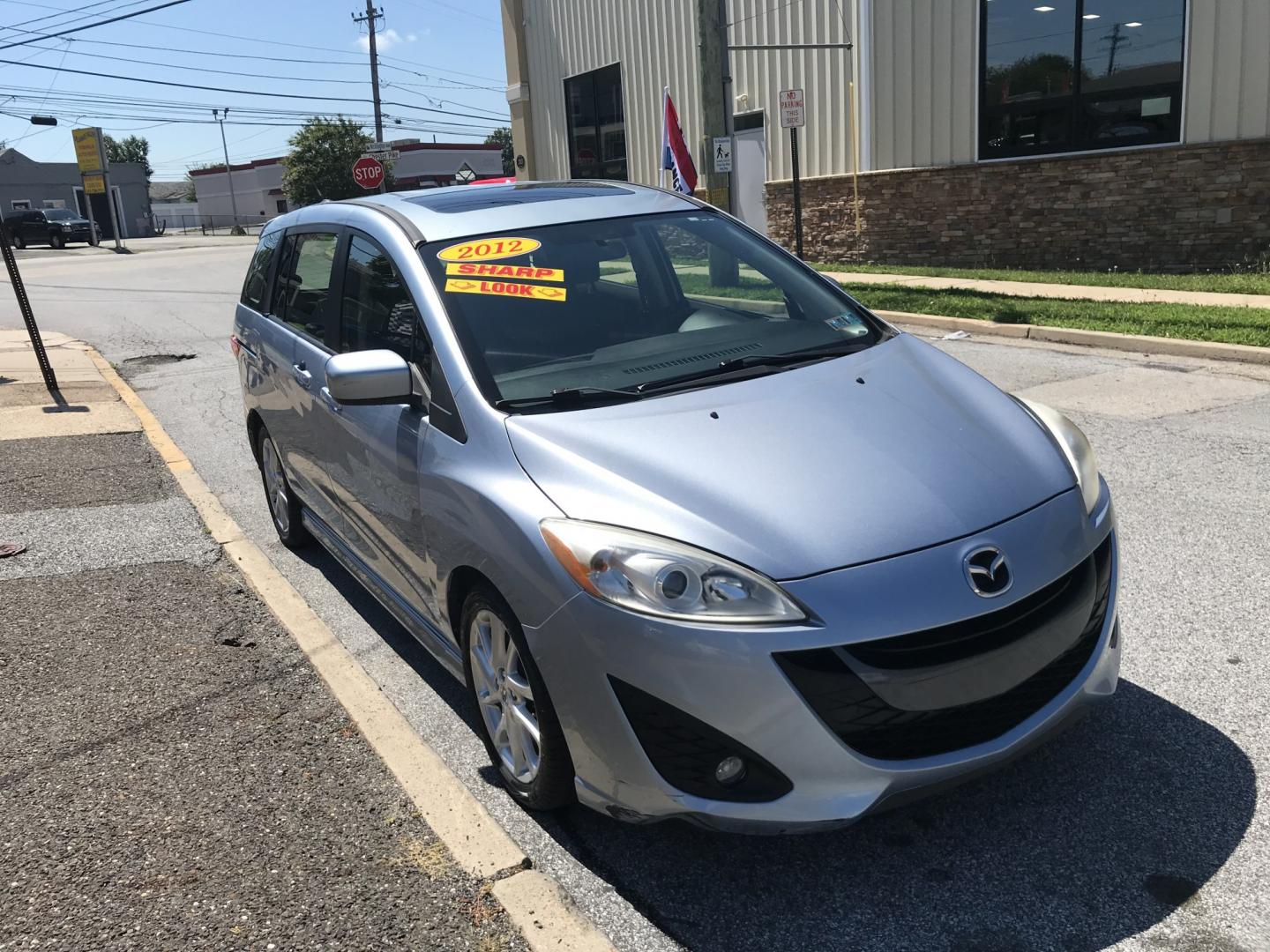 2012 Blue /Gray Mazda MAZDA5 Touring (JM1CW2CL5C0) with an 2.5L L4 DOHC 16V engine, 5-Speed Automatic transmission, located at 577 Chester Pike, Prospect Park, PA, 19076, (610) 237-1015, 39.886154, -75.302338 - 2012 Mazda 5 Touring: 3rd row seating, only 129k miles, new PA inspection, great on gas, runs LIKE NEW! This vehicle comes inspected and has been given a bumper to bumper safety check. It is very clean, reliable, and well maintained. We offer a unique pay plan that is known for being the easiest- Photo#3