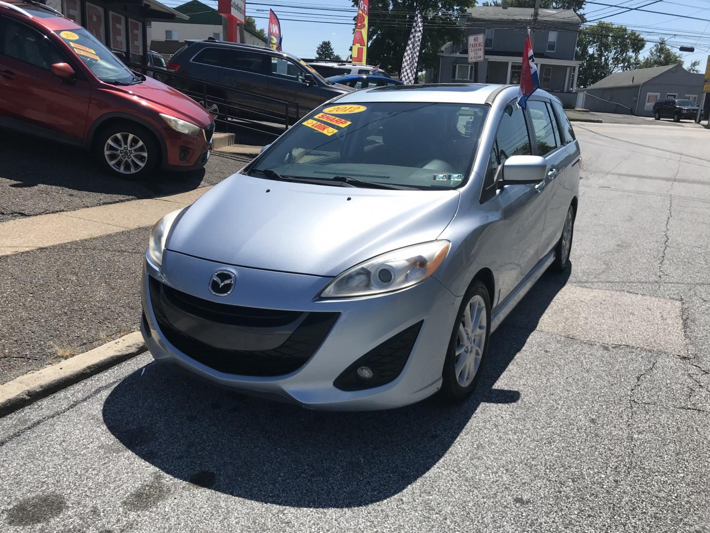 2012 Blue /Gray Mazda MAZDA5 Touring (JM1CW2CL5C0) with an 2.5L L4 DOHC 16V engine, 5-Speed Automatic transmission, located at 577 Chester Pike, Prospect Park, PA, 19076, (610) 237-1015, 39.886154, -75.302338 - 2012 Mazda 5 Touring: 3rd row seating, only 129k miles, new PA inspection, great on gas, runs LIKE NEW! This vehicle comes inspected and has been given a bumper to bumper safety check. It is very clean, reliable, and well maintained. We offer a unique pay plan that is known for being the easiest- Photo#2