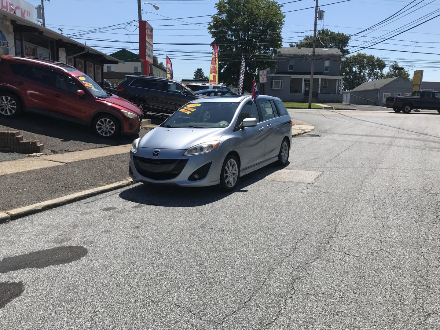 2012 Blue /Gray Mazda MAZDA5 Touring (JM1CW2CL5C0) with an 2.5L L4 DOHC 16V engine, 5-Speed Automatic transmission, located at 577 Chester Pike, Prospect Park, PA, 19076, (610) 237-1015, 39.886154, -75.302338 - 2012 Mazda 5 Touring: 3rd row seating, only 129k miles, new PA inspection, great on gas, runs LIKE NEW! This vehicle comes inspected and has been given a bumper to bumper safety check. It is very clean, reliable, and well maintained. We offer a unique pay plan that is known for being the easiest- Photo#1