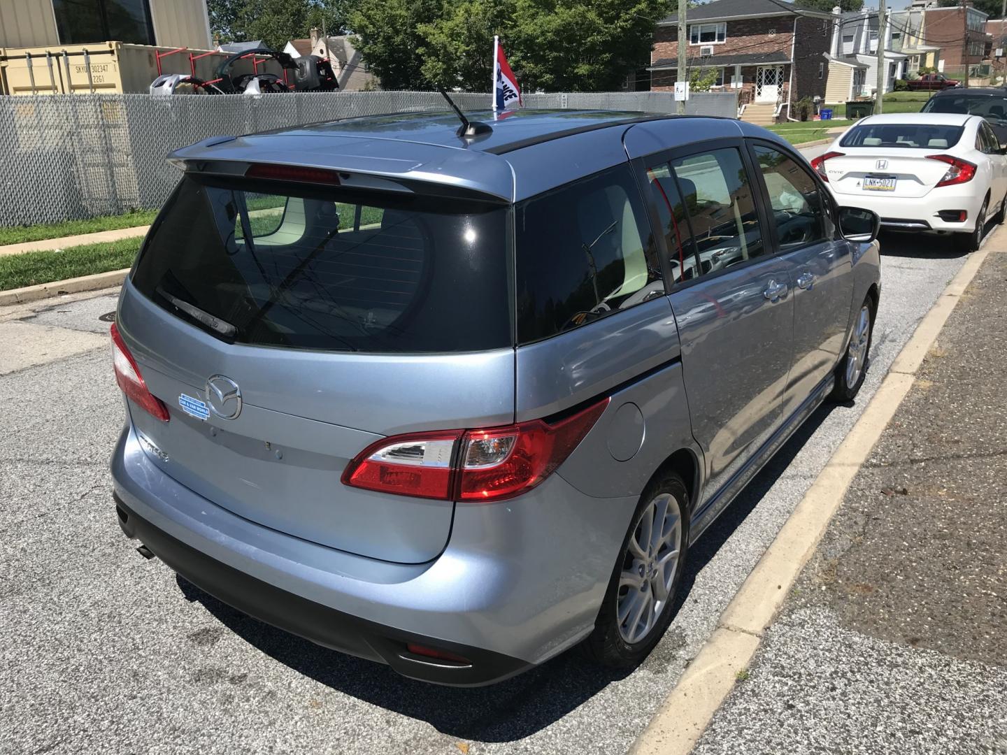 2012 Blue /Gray Mazda MAZDA5 Touring (JM1CW2CL5C0) with an 2.5L L4 DOHC 16V engine, 5-Speed Automatic transmission, located at 577 Chester Pike, Prospect Park, PA, 19076, (610) 237-1015, 39.886154, -75.302338 - 2012 Mazda 5 Touring: 3rd row seating, only 129k miles, new PA inspection, great on gas, runs LIKE NEW! This vehicle comes inspected and has been given a bumper to bumper safety check. It is very clean, reliable, and well maintained. We offer a unique pay plan that is known for being the easiest- Photo#4