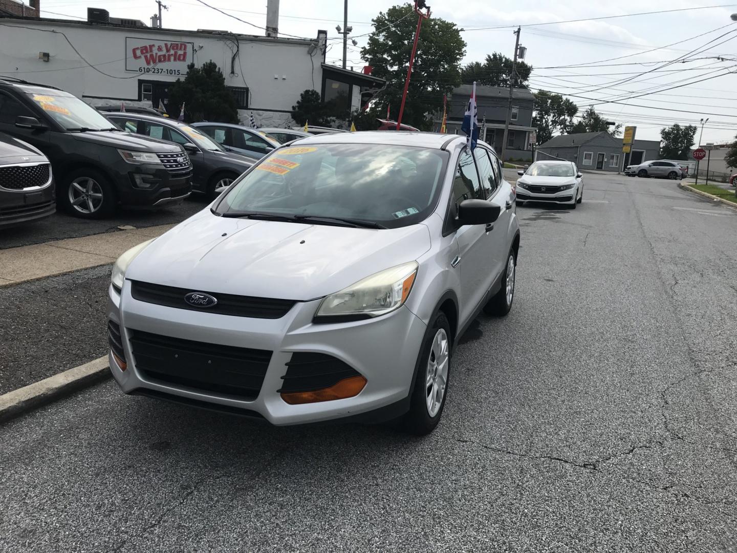 2016 Silver /Black Ford Escape S (1FMCU0F78GU) with an 2.5L L4 DOHC 16V engine, 6A transmission, located at 577 Chester Pike, Prospect Park, PA, 19076, (610) 237-1015, 39.886154, -75.302338 - 2016 Ford Escape S: Only 121k miles, great on gas, new PA inspection, SUPER CLEAN, runs LIKE NEW! This vehicle comes inspected and has been given a bumper to bumper safety check. It is very clean, reliable, and well maintained. We offer a unique pay plan that is known for being the easiest and fa- Photo#2