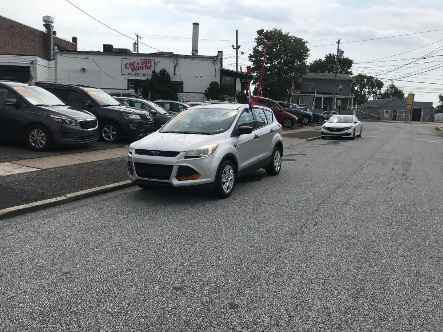 2016 Silver /Black Ford Escape S (1FMCU0F78GU) with an 2.5L L4 DOHC 16V engine, 6A transmission, located at 577 Chester Pike, Prospect Park, PA, 19076, (610) 237-1015, 39.886154, -75.302338 - 2016 Ford Escape S: Only 121k miles, great on gas, new PA inspection, SUPER CLEAN, runs LIKE NEW! This vehicle comes inspected and has been given a bumper to bumper safety check. It is very clean, reliable, and well maintained. We offer a unique pay plan that is known for being the easiest and fa- Photo#1